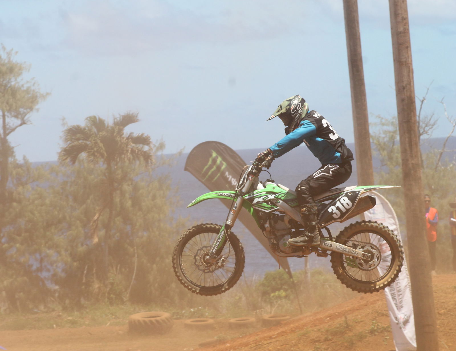 Corry Pangelinan holds on as he executes a jump in the third round of the MRA Race Points series Sunday at Cow Town Raceway Park.Photo by James F. Sablan Jr.