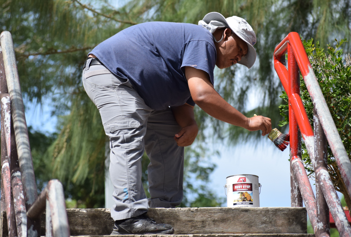 Rep. John Paul Sablan applies paint on the railing of the Saipan Skate Park in Garapan.Photo by Emmanuel T. Erediano