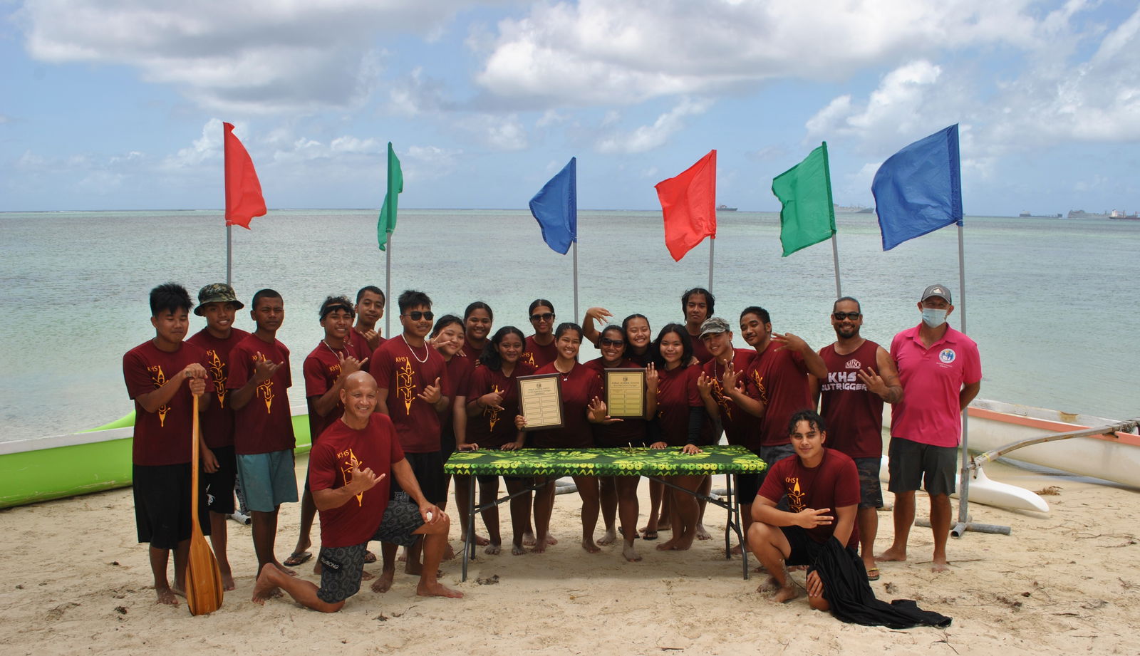 Kagman High School’s men's and co-ed team members pose with the perpetual trophies they won in the 2021 PSS Interscholastic Outrigger Race Points Series on Saturday at  Kilili Beach.Photo by James F. Sablan Jr. 