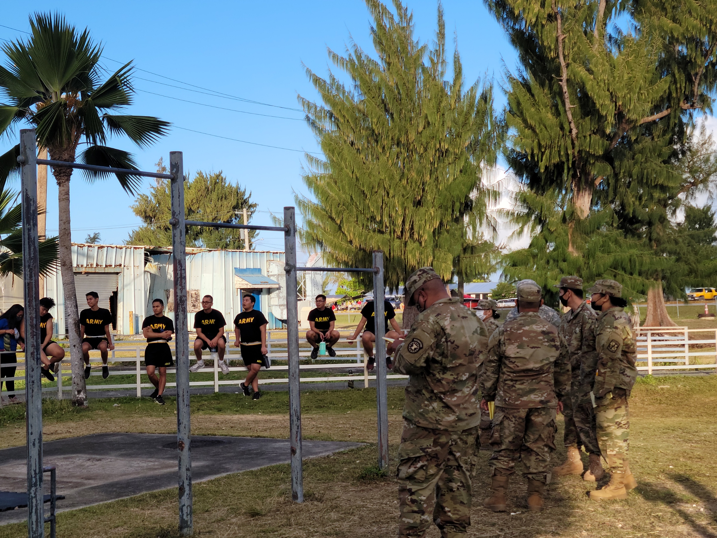 NMC SROTC cadets wait patiently in the background as scorers tally results of the pull-up challenge. Photo by K-Andrea Evarose S. Limol