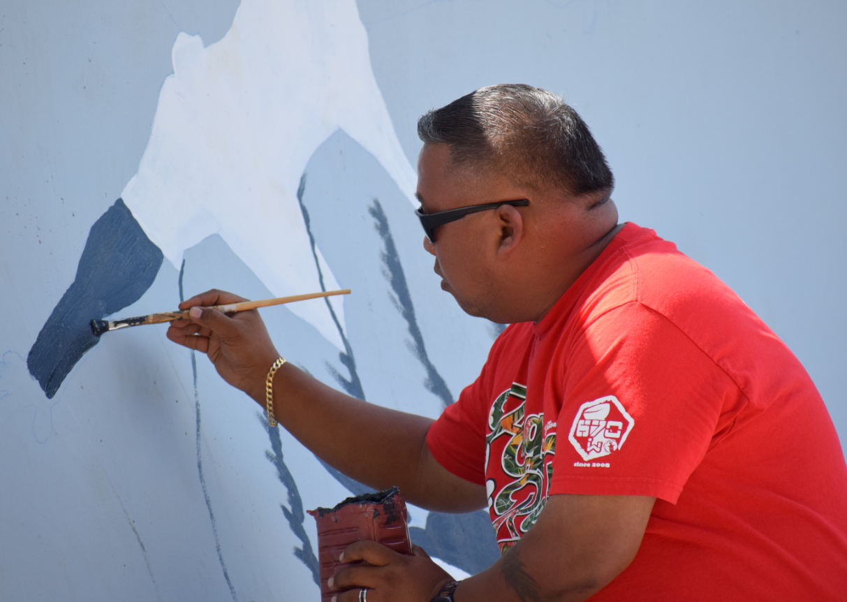 Rep. Angel Demapan paints a mural on one of the ramps at Saipan Skate Park.Photo by Emmanuel T. Erediano