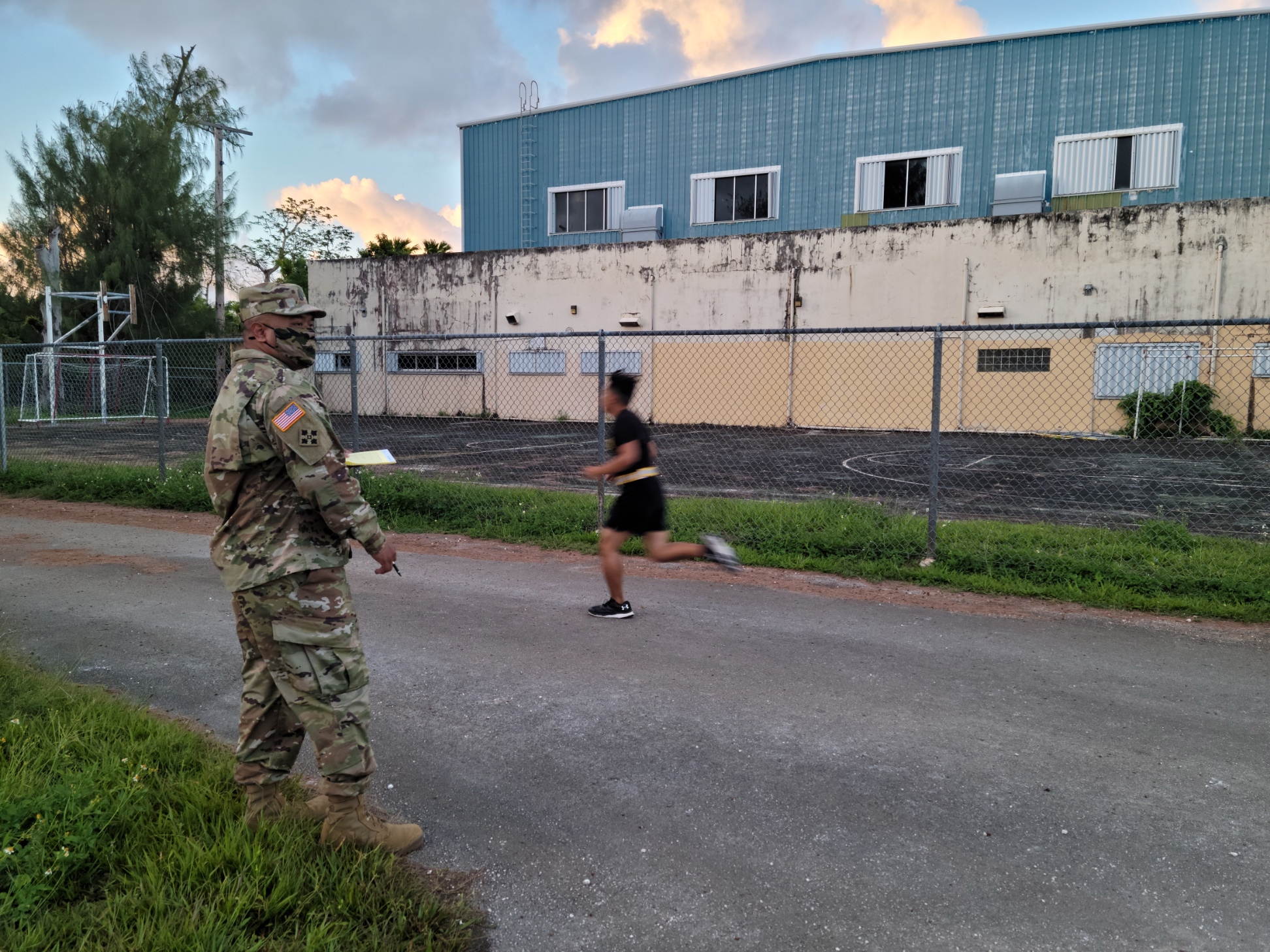 SFC Romeo Igisomar, left, looks on as cadets execute the mile run.Photo by K-Andrea Evarose S. Limol