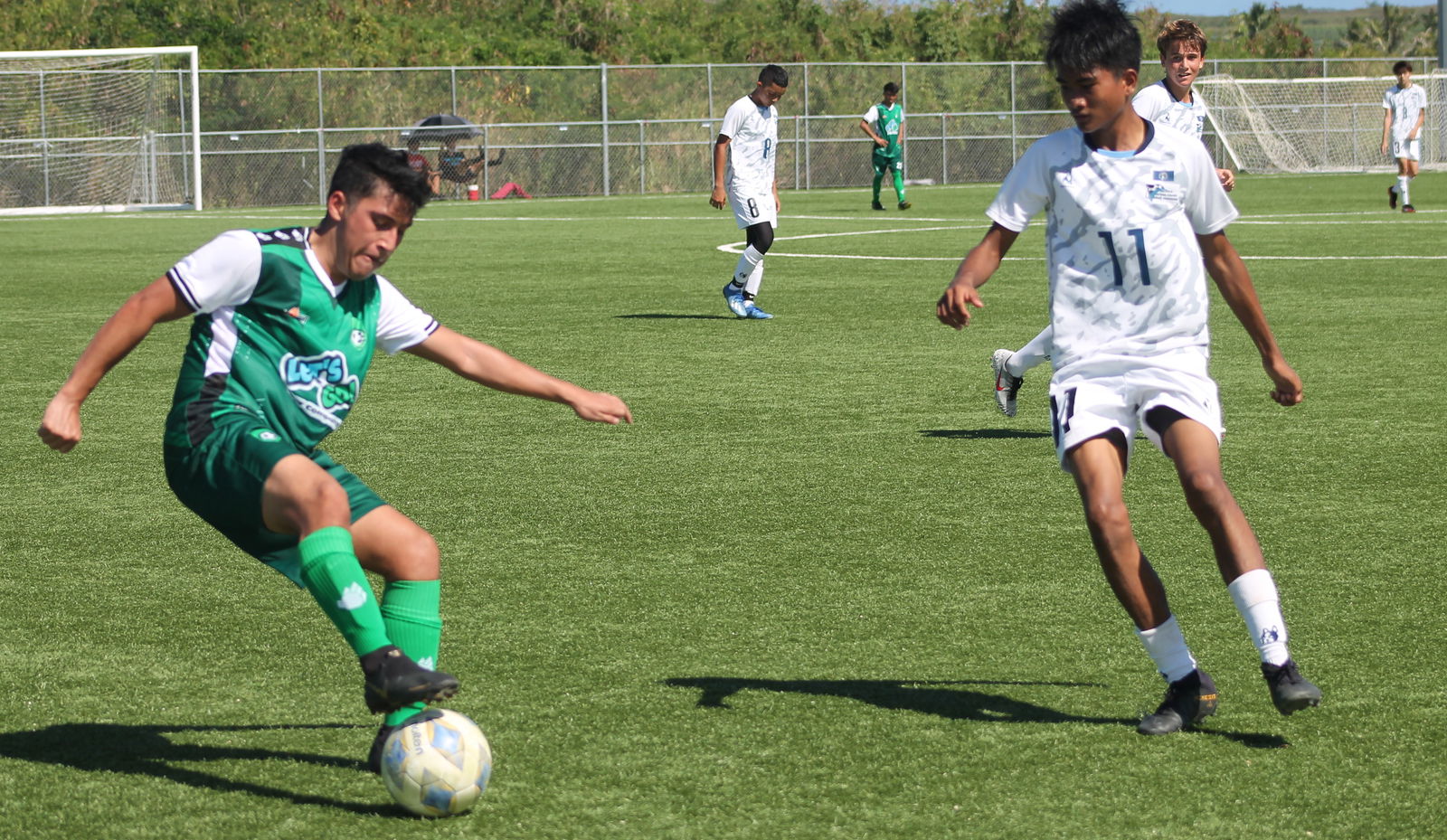 TanHoldings’ Jacob Montes tries to outmaneuver a defender.