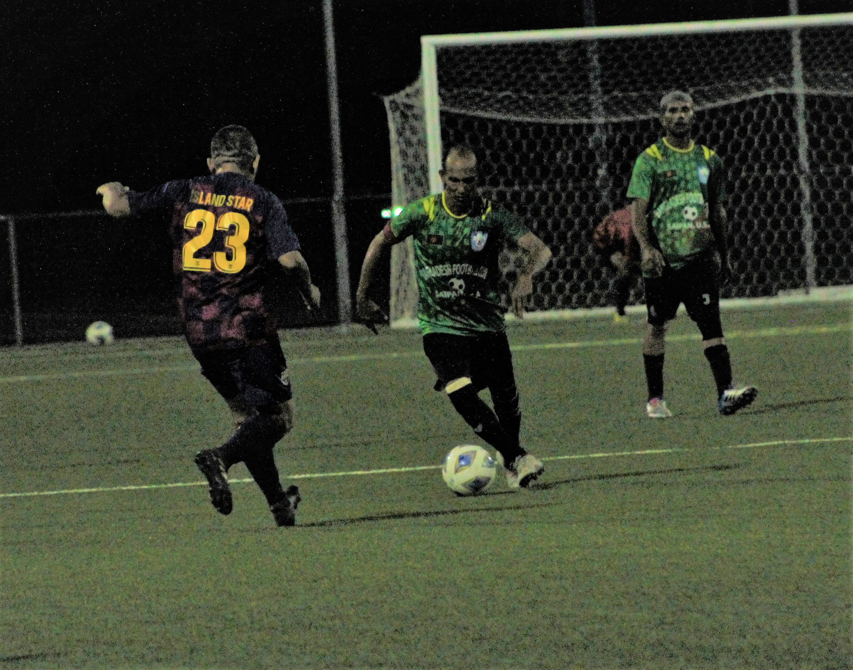 A Bangladesh Football Club player dribbles against a defender during  a Men's M-League Spring 2021 Division B game, Saturday, at the NMI Soccer Training Center.Photo by James F. Sablan Jr.