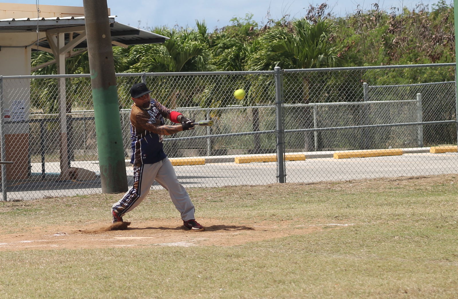 PeLeLiu's James Fleming connects a hit during a Belau Amateur Softball League game at the Dandan baseball field.Photo by James F. Sablan Jr.