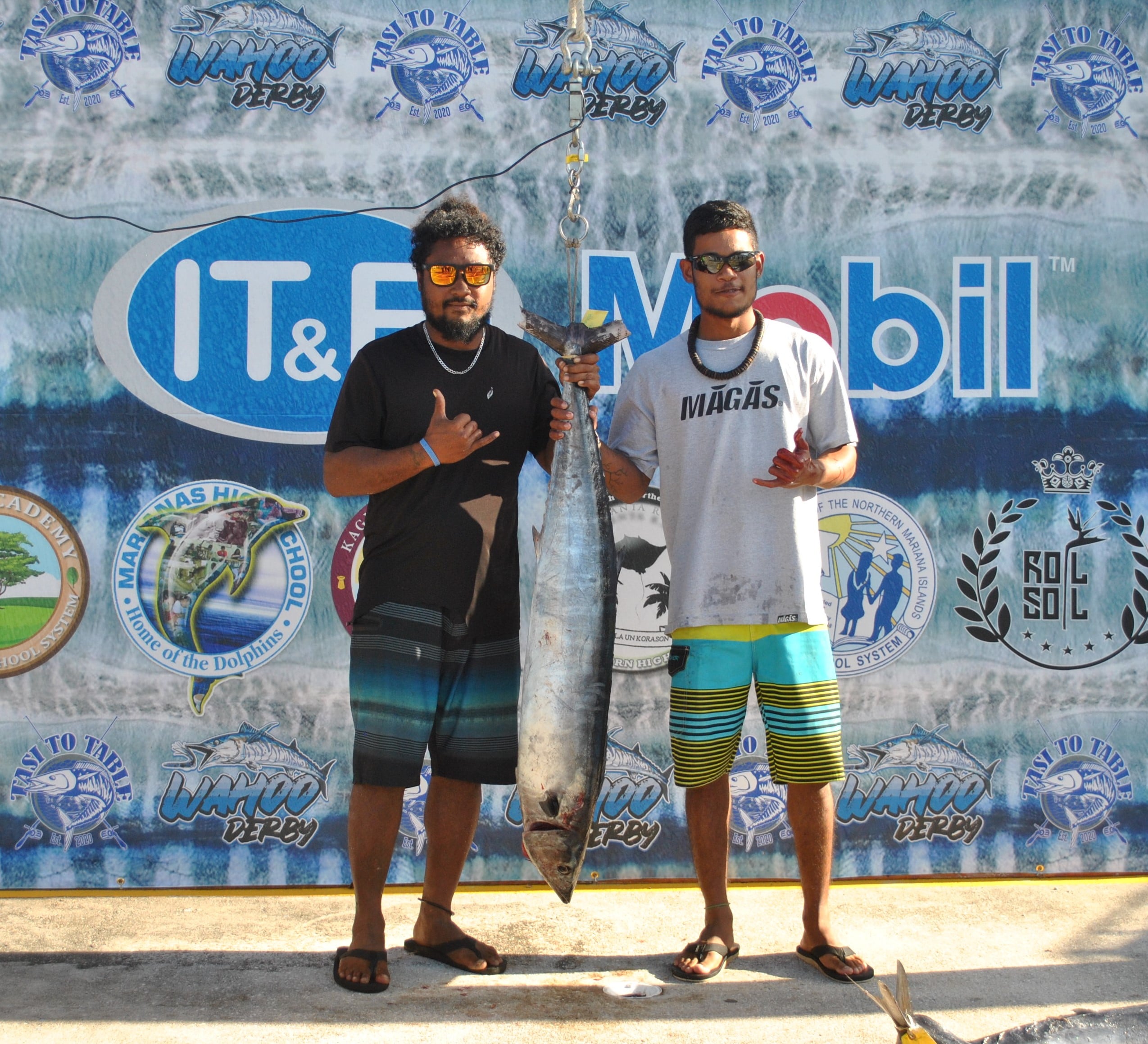 The crew members of Lucky Harvest pose with their winning wahoo catch.Photo by James F. Sablan Jr.