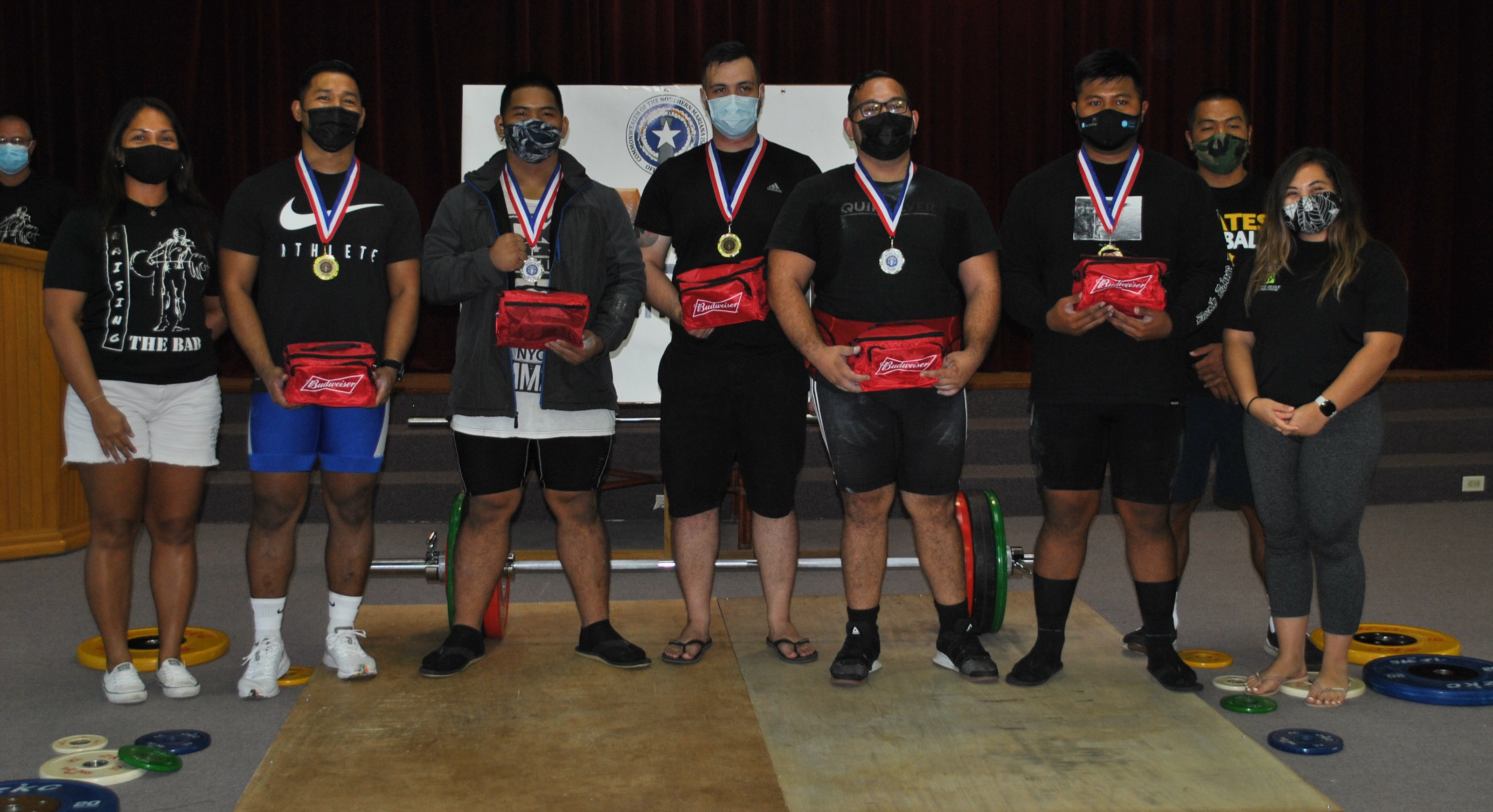The participants in the 96kg and above weight category pose with CNMI Weightlifting officials during the awards ceremony of the 2nd Marianas Cup Saturday at the multi-purpose center.Photo by James F. Sablan Jr