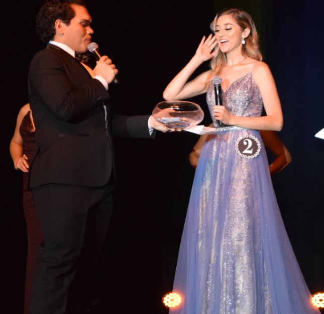 Lily Carillo is about to pick a question from a glass bowl held by host Romolo Orsini. Photo by Emmanuel T. Erediano