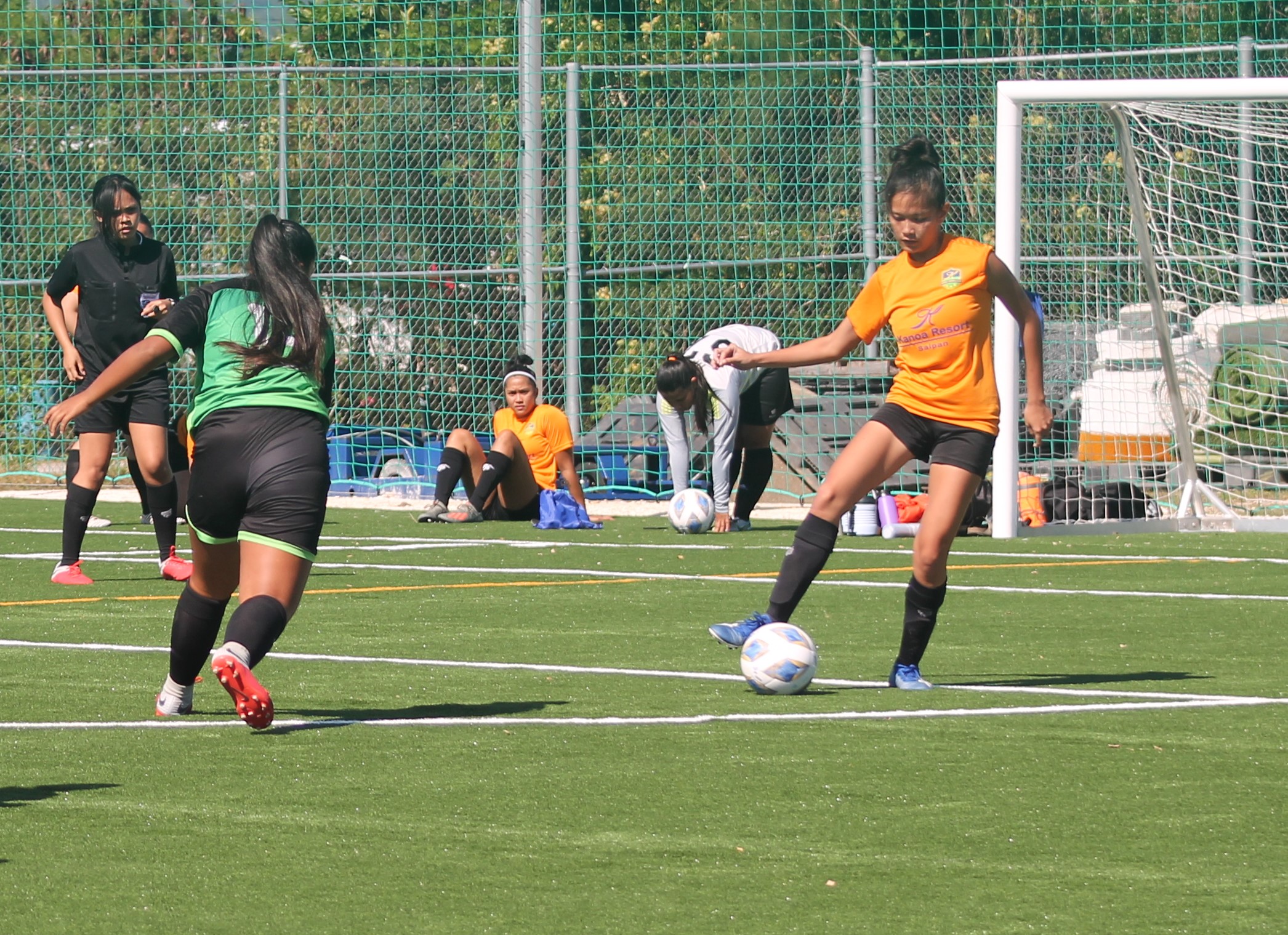 Kanoa Football Club’s Khristelle Itaas extends in the battle for possession during a Dove Women's League Spring 2021 Division A game held Sunday at the NMI Soccer Training Center mini-pitch.Photo by James F. Sablan Jr.
