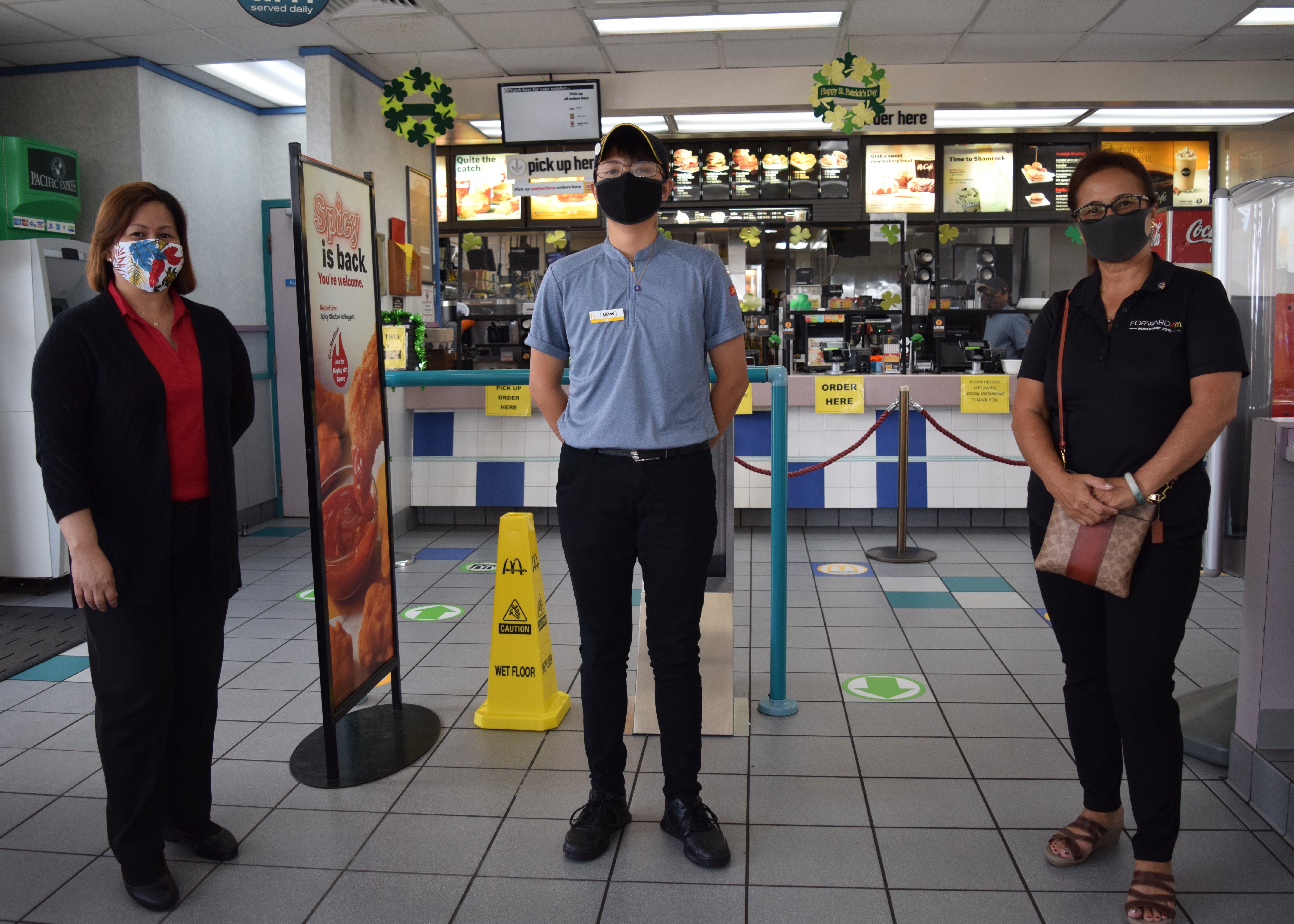 Shane Barro, center, with McDonald’s owner/operator Marcia Ayuyu, right, and Middle Road general manager Jocelyn Asistores.Photo by Emmanuel T. Erediano