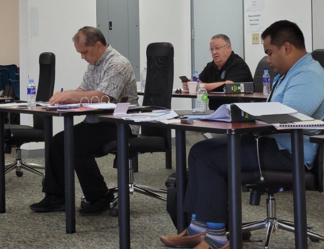 From left, Commonwealth Utilities Corp.  Executive Director Gary Camacho, CUC Deputy Executive Director William Gilmore, center, and CUC legal counsel  Jose Mafnas Jr. at the CUC board meeting on Friday.Photo by Bryan Manabat