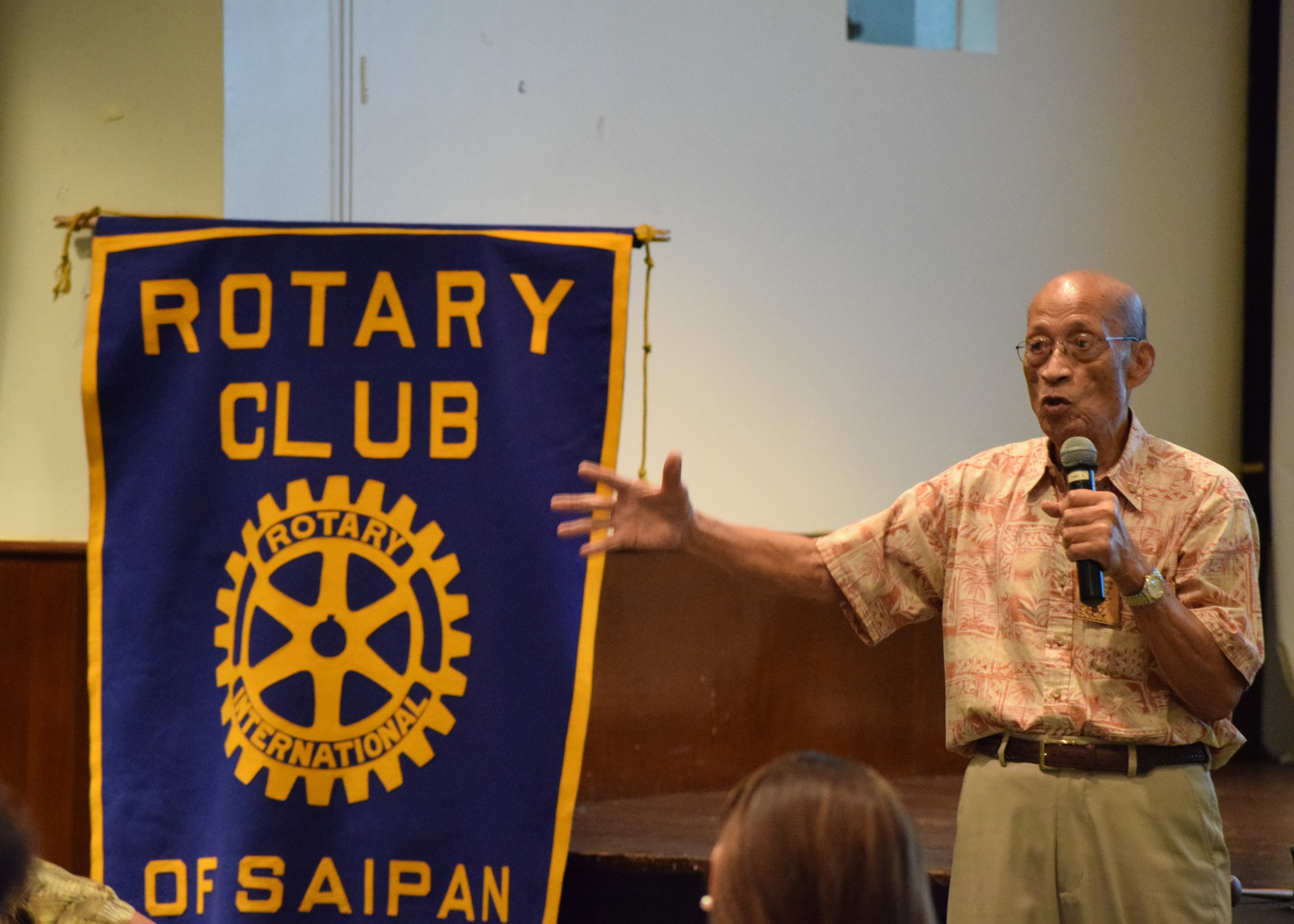 The Rotary Club of Saipan’s first president, David “Uncle Dave” Mangarero Sablan, speaks on Charter Night in the Hibiscus Hall of the Crowne Plaza Resort on Tuesday.Photo by Emmanuel T. Erediano