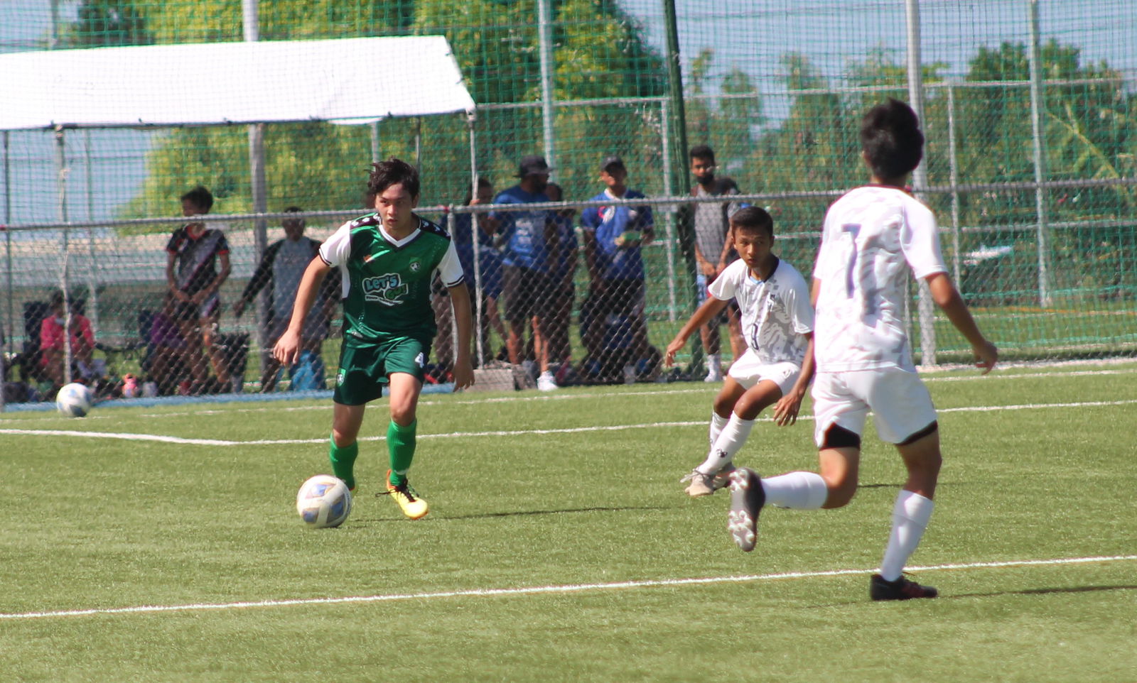 TanHoldings’ Terrence Montenegro prepares the offensive play.