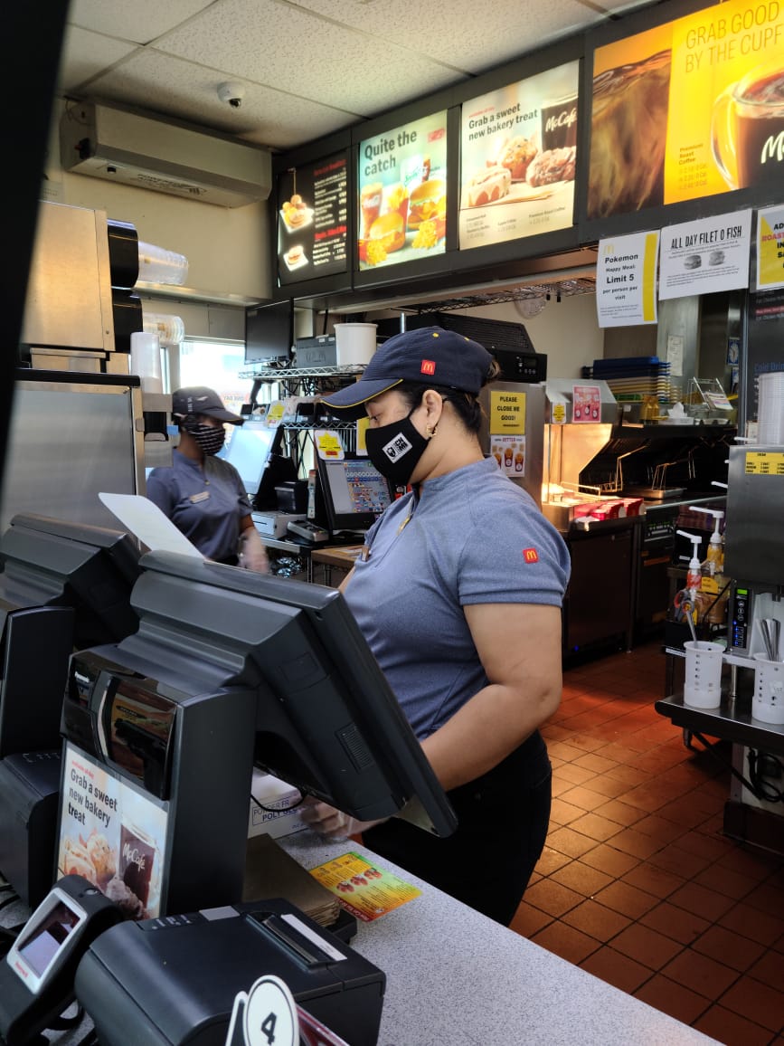 Rinie Fiden operates the cash register at McDonald’s Garapan.Photo by Emmanuel T. Erediano