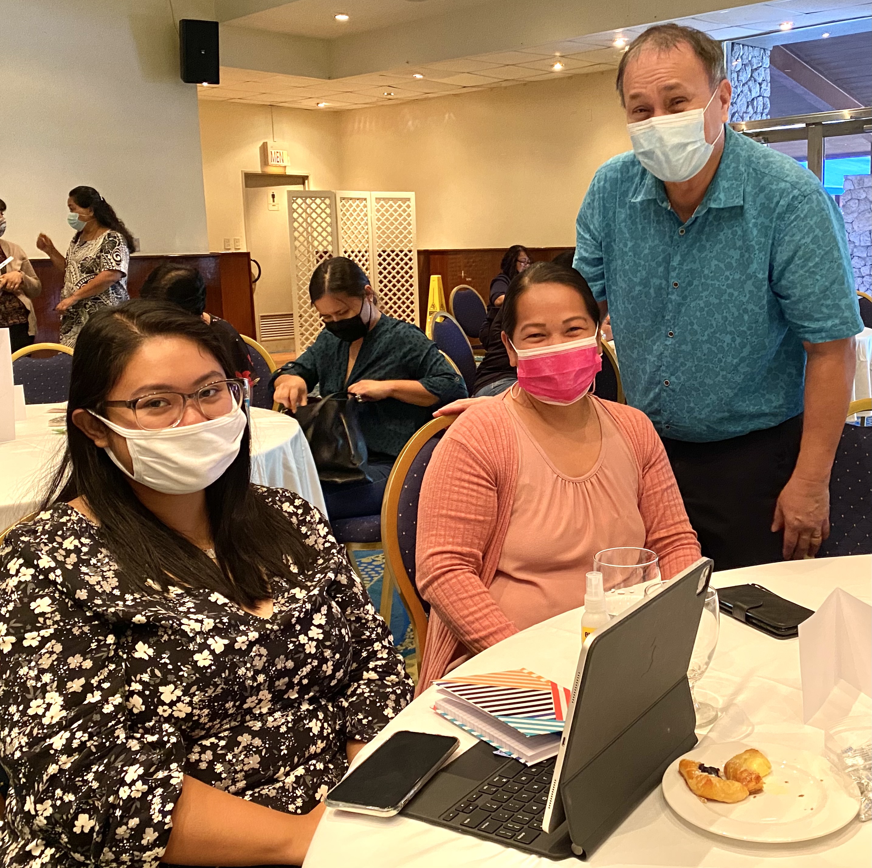 Chairman Andrew L. Orsini with Denicia Dela Cruz (Instructional Technology & Distance Education Program) and Myrna Babauta (Student Support and Services).