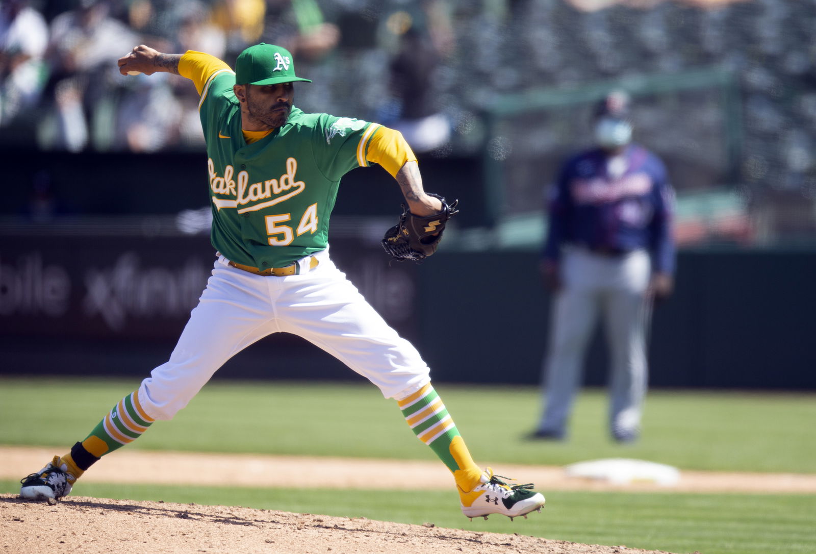 Oakland Athletics pitcher Sergio Romo (54) delivers a pitch against the Minnesota Twins during the sixth inning of a Major League Baseball game at RingCentral Coliseum in Oakland, California on April 21, 2021.Photo by D. Ross Cameron-USA TODAY Sports