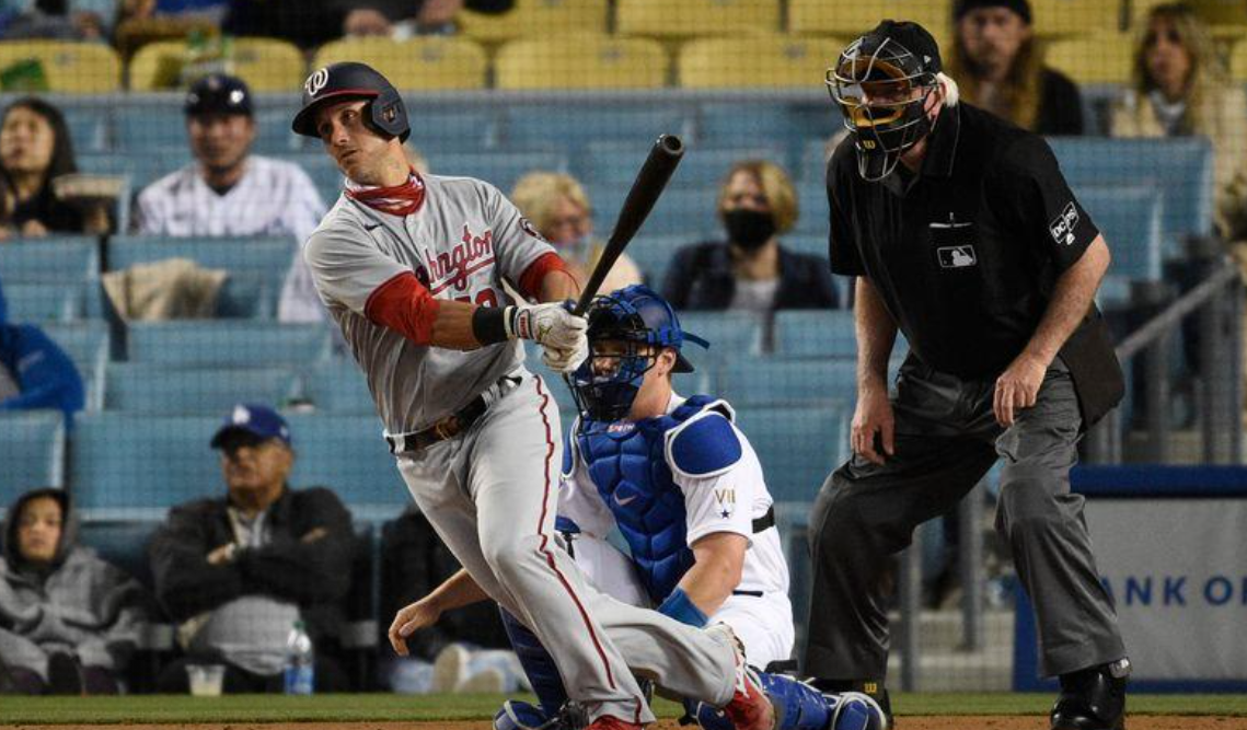 Washington Nationals catcher Yan Gomes (10) follows through on a swing for an RBI single during the sixth inning against the Los Angeles Dodgers at Dodger Stadium in Los Angeles, California on April 10, 2021.Photo by Kelvin Kuo-USA TODAY Sports
