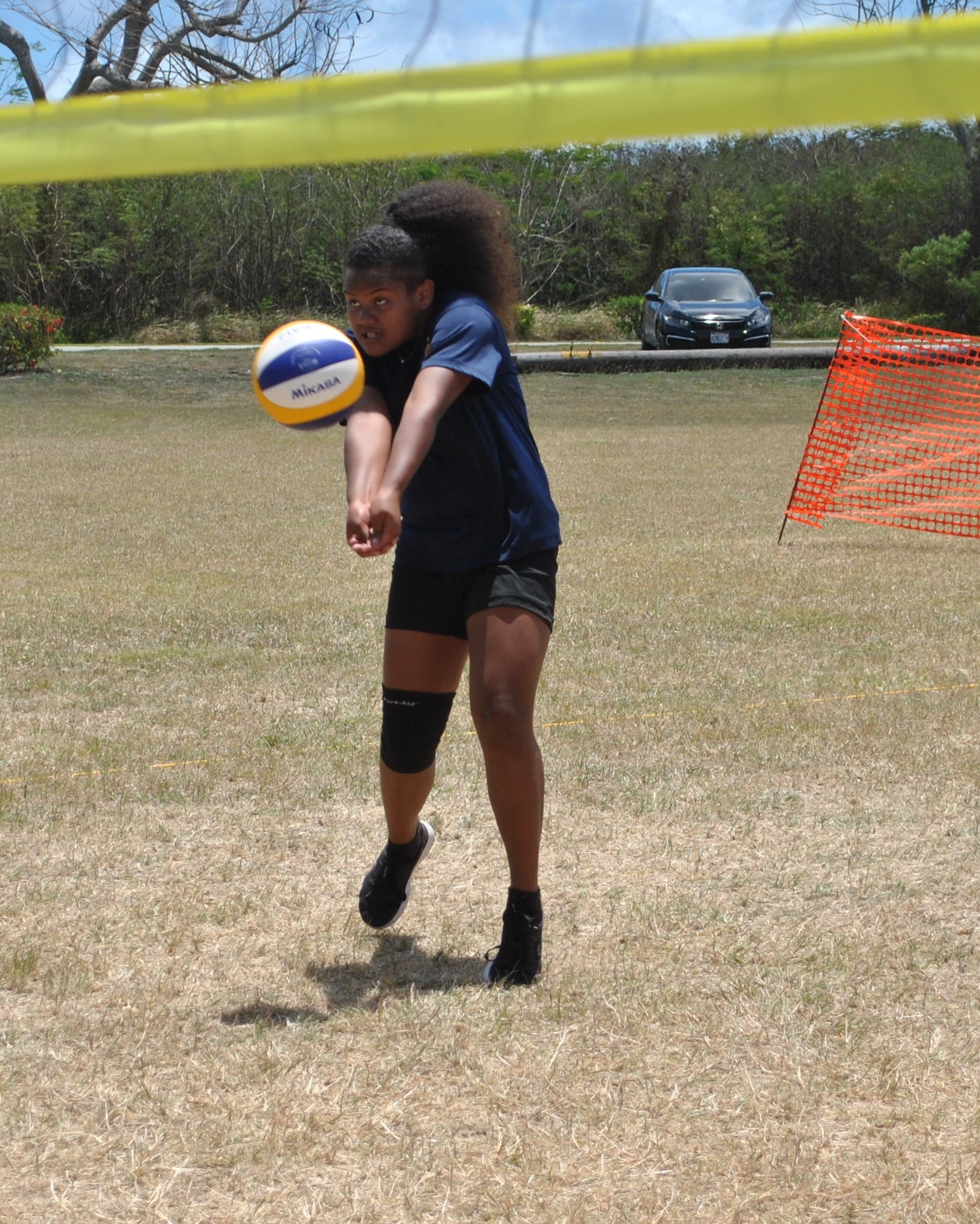 A Hopwood Middle School player returns with a bump in the championship game of the PSS Girls 4v4 Grass Volleyball League on Saturday at the CPA Airport Field.Photo by James F. Sablan Jr.