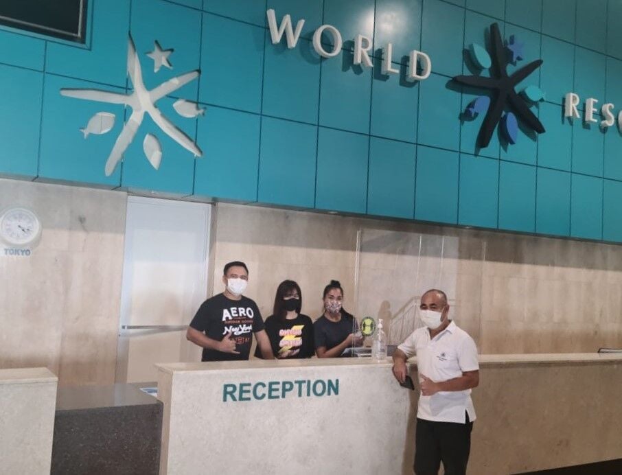 Saipan World Resort local sales and marketing manager Mike Babauta, right, poses with front desk staffers.Photo by Emmanuel T. Erediano