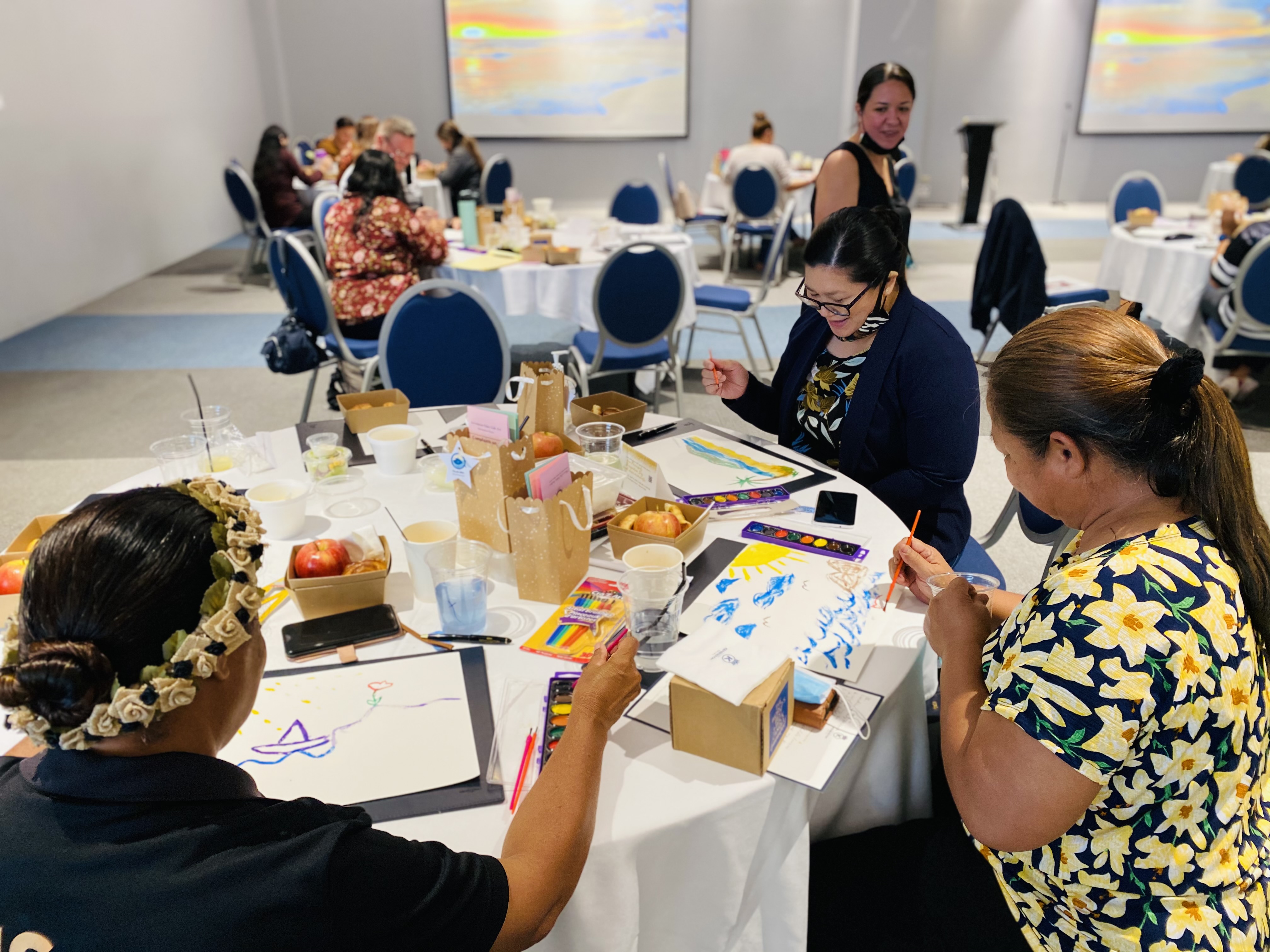 Dr. Jennifer F. Maratita assists vice principals in a stress-relieving activity: water color painting.
