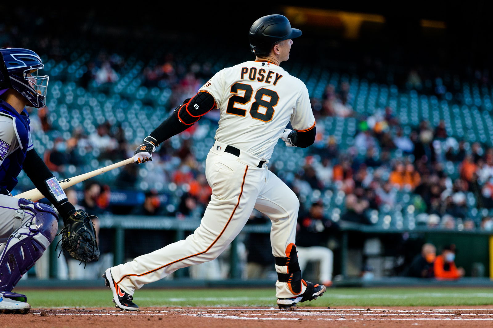 San Francisco Giants catcher Buster Posey (28) hits an RBI double against the Colorado Rockies during the first inning at Oracle Park in San Francisco, California on April 26, 2021.Photo by John Hefti-USA TODAY Sports