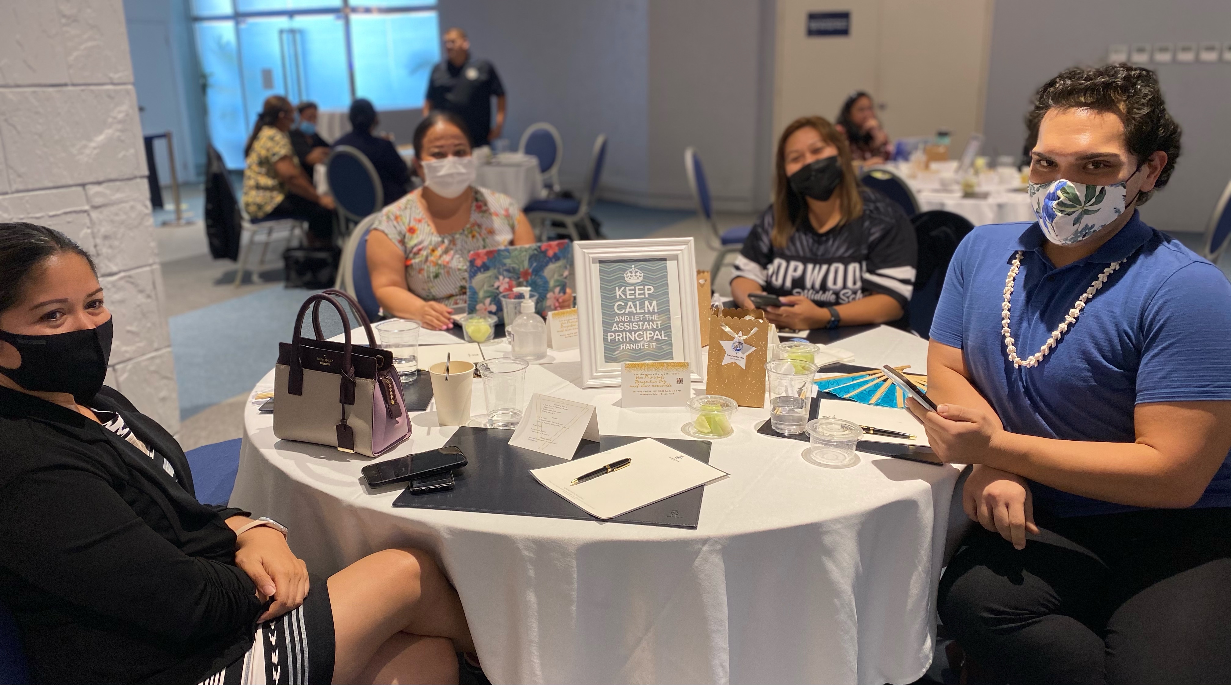 From left, Public School System finance and budget director Arlene Lizama and human resources officer Lucretia Deleon Guerrero with Hopwood Middle School vice principal Karen Manuel and Marianas High School vice principal Romolor Orsini.