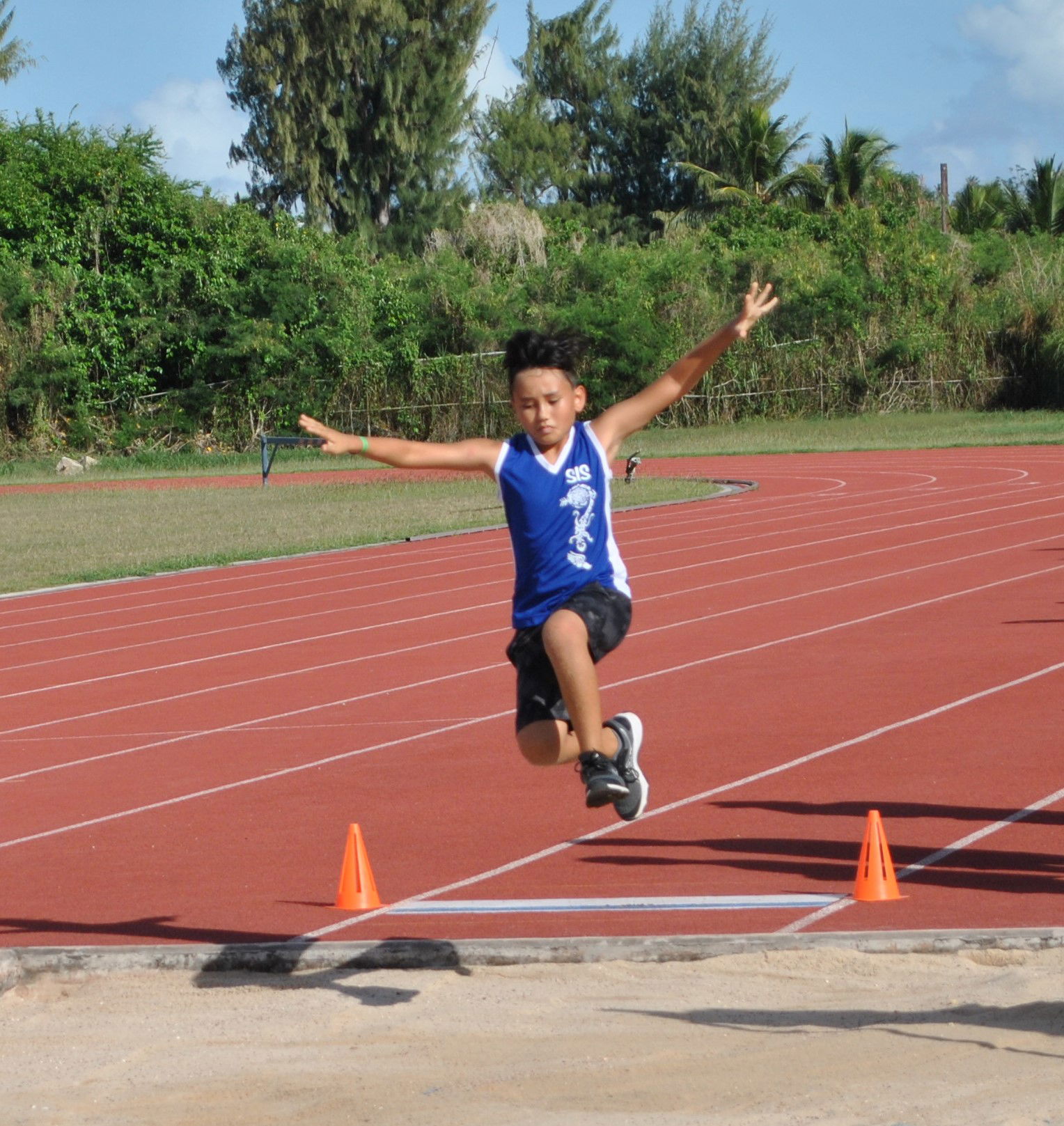 A Saipan International School student takes off during the U9 Long Jump event of the PSS All School Track & Field Qualifiers, Tuesday, at the Oleai Sports Complex.Photo by James F. Sablan Jr.