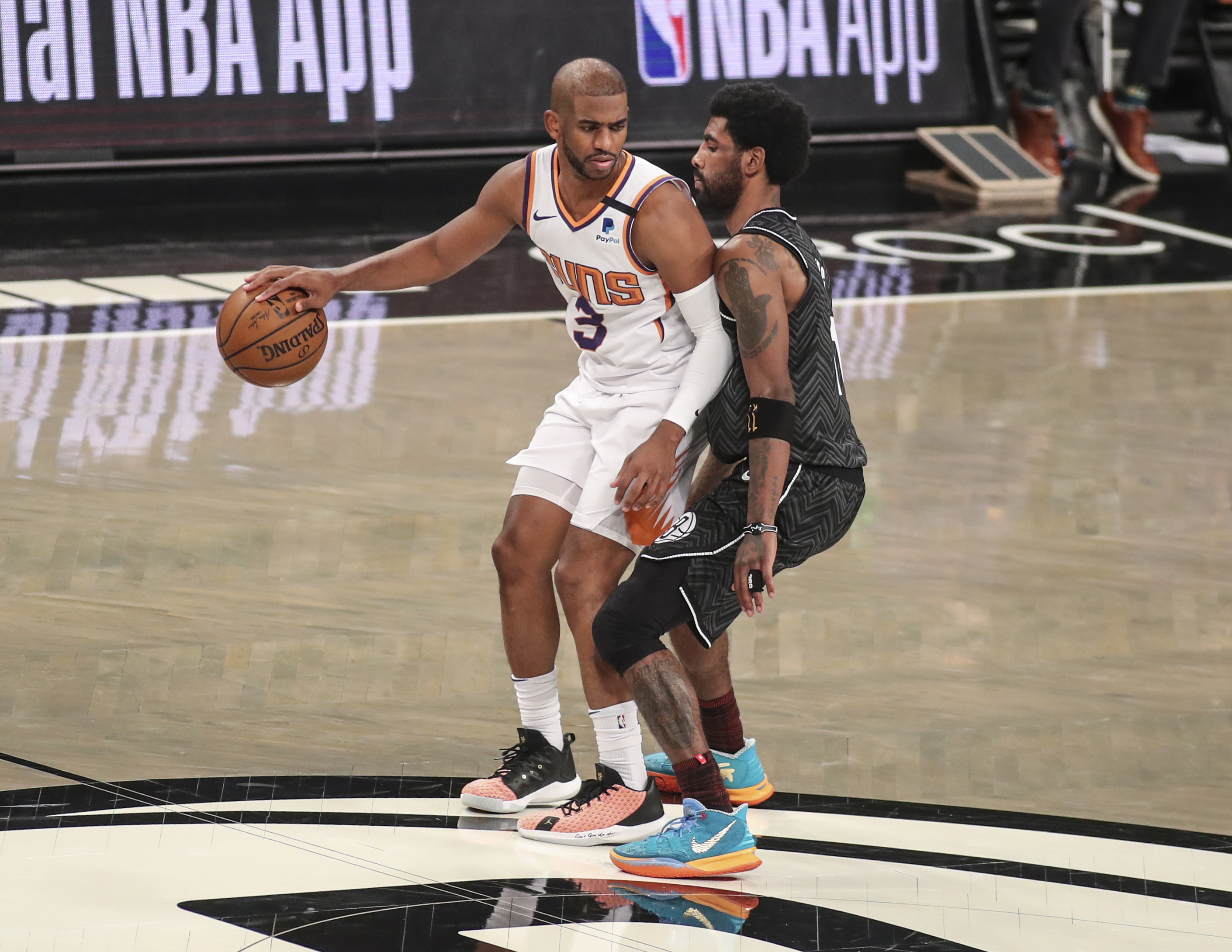Phoenix Suns guard Chris Paul (3) is guarded by Brooklyn Nets guard Kyrie Irving (11) at Barclays Center in Brooklyn, New York on April 25, 2021.Photo by Wendell Cruz-USA TODAY Sports