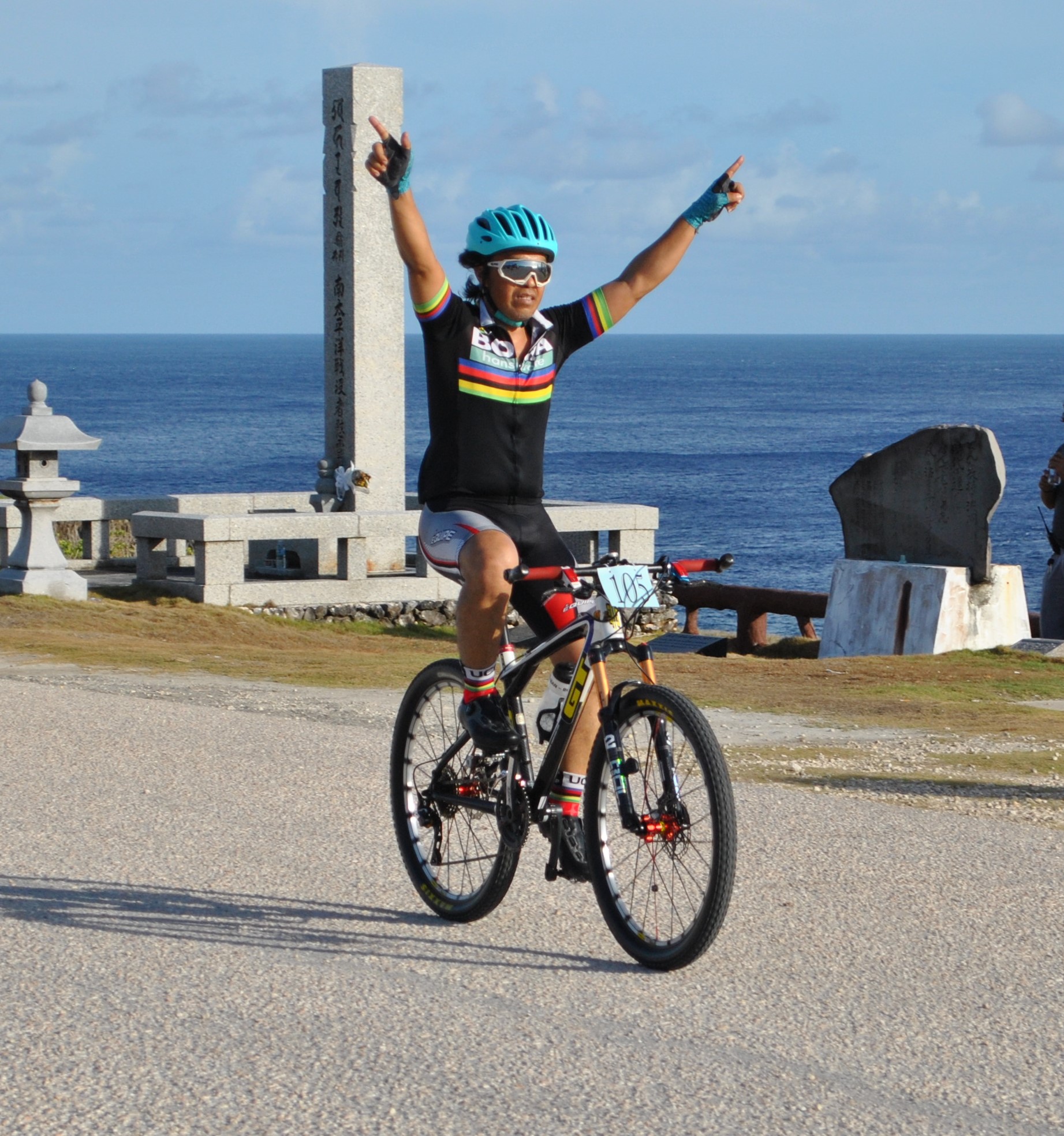 Edwin Angeles is happy to cross the finish line in the short course of the Saipan Unity Lions Club 5th Annual Bike Race at Banzai Cliff on Sunday.Photo by James F. Sablan Jr.