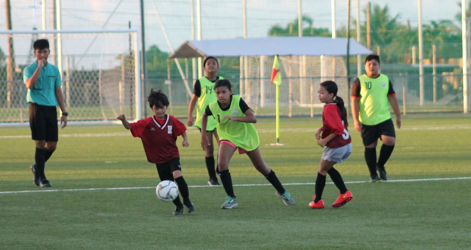 Saipan Community School’s Jose Sablan dribbles against defenders during the championship game of the 2020-2021 NMIFA-PSS Interscholastic Soccer League on Thursday at the NMI Soccer Training Center.Photo by James F. Sablan Jr.