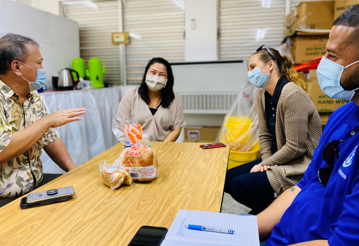 Board of Education Chairman Andrew L. Orsini shares a light moment with San Vicente Elementary School principal Paulette T. Sablan, vice principal Ana Guerrero, and Student Attendance Review Committee coordinator Bobby Coldeen.