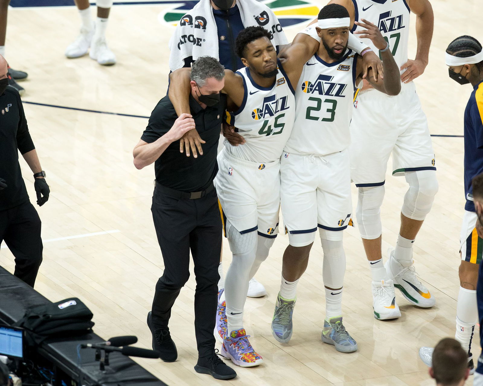 Utah Jazz guard Donovan Mitchell (45) is helped off the court after suffering an apparent injury during the second half against the Indiana Pacers at Vivint Smart Home Arena in Salt Lake City, Utah on April 16, 2021.Photo by Russell Isabella-USA TODAY Sports