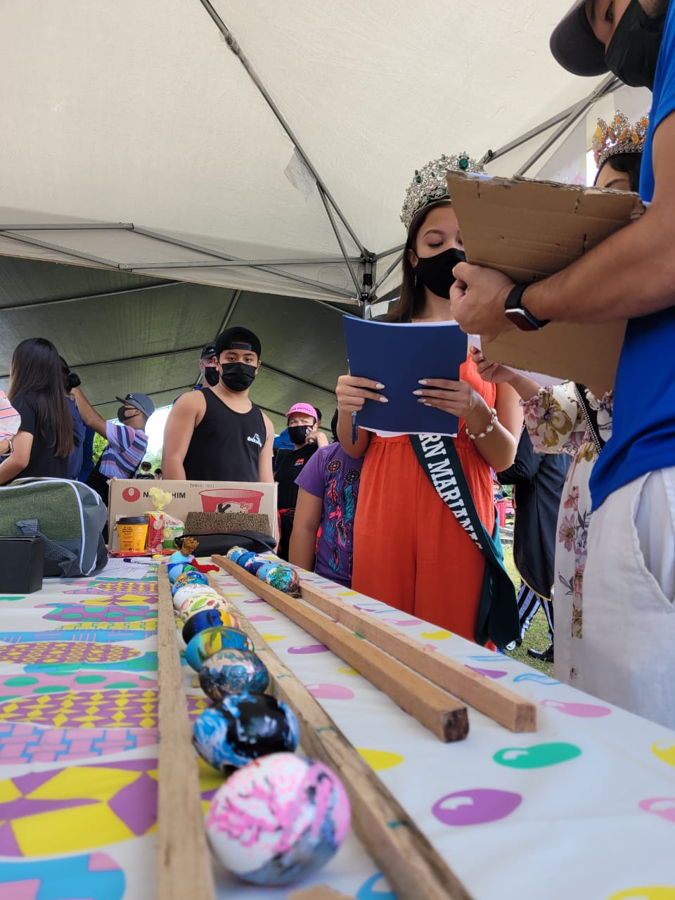 Judges look at each of the Easter eggs decorated by high school students at Sugar King Park in Garapan on Saturday.Photo by Emmanuel T. Erediano