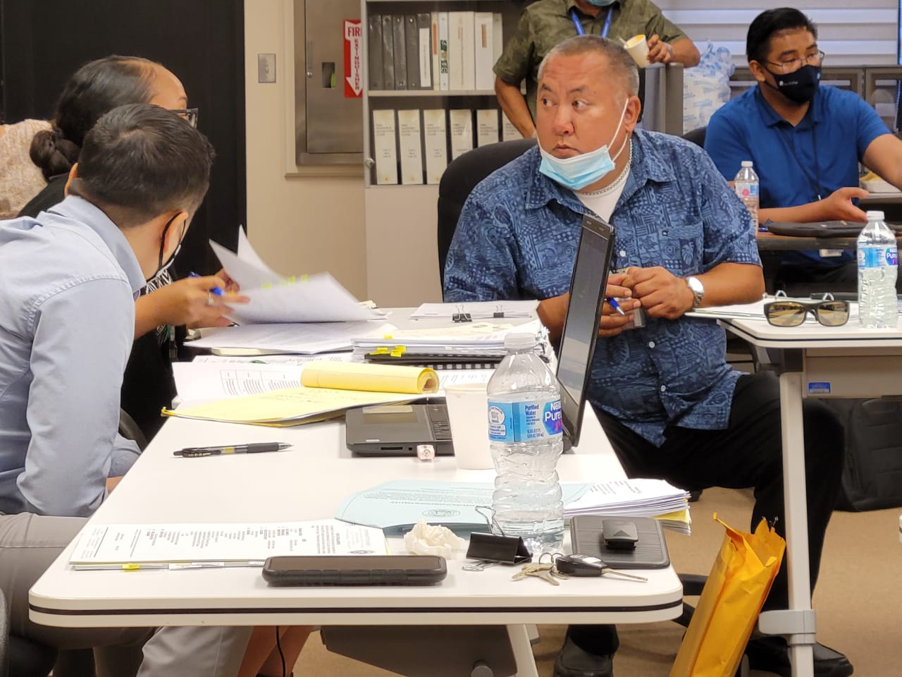 Commonwealth Ports Authority Executive Director Christopher Tenorio, right, listens to another CPA official during a break from a board meeting on Wednesday in the Aircraft Rescue and Firefighting classroom.Photo by Emmanuel T. Erediano