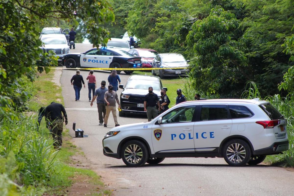 Guam police officers are investigating the discovery of a body on Swamp Road in Dededo.Photo by Dontana Keraskes/The Guam Daily Post