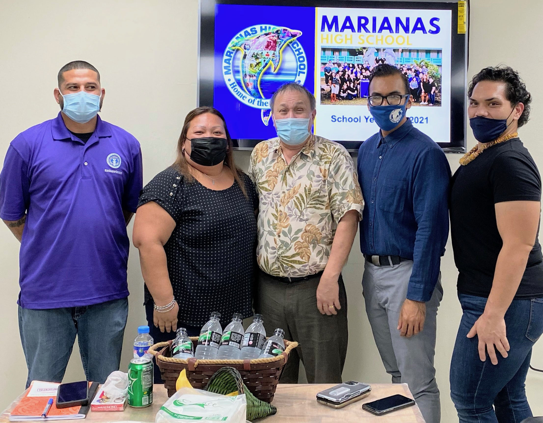 Marianas High School principal Jonathan Aguon and vice principals Melania Rdiall and Romolor Orsini with Board of Education Chairman Andrew L. Orsini