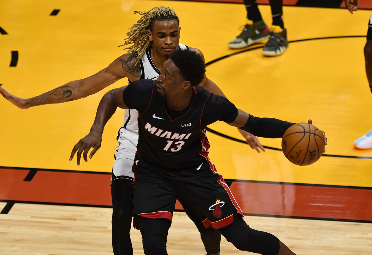 Brooklyn Nets forward Nicolas Claxton (33) defends Miami Heat center Bam Adebayo (13) during the second half at American Airlines Arena in Miami, Florida, April 18, 2021.Photo by Jim Rassol-USA TODAY Sports