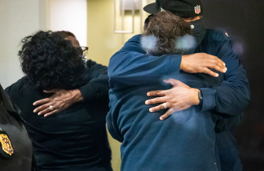 People embrace after learning that their loved one was safe after a mass casualty shooting at the FedEx facility in Indianapolis, Indiana, April 16, 2021.Photo by Mykal McEldowney/IndyStar/USA Today Network via REUTERS