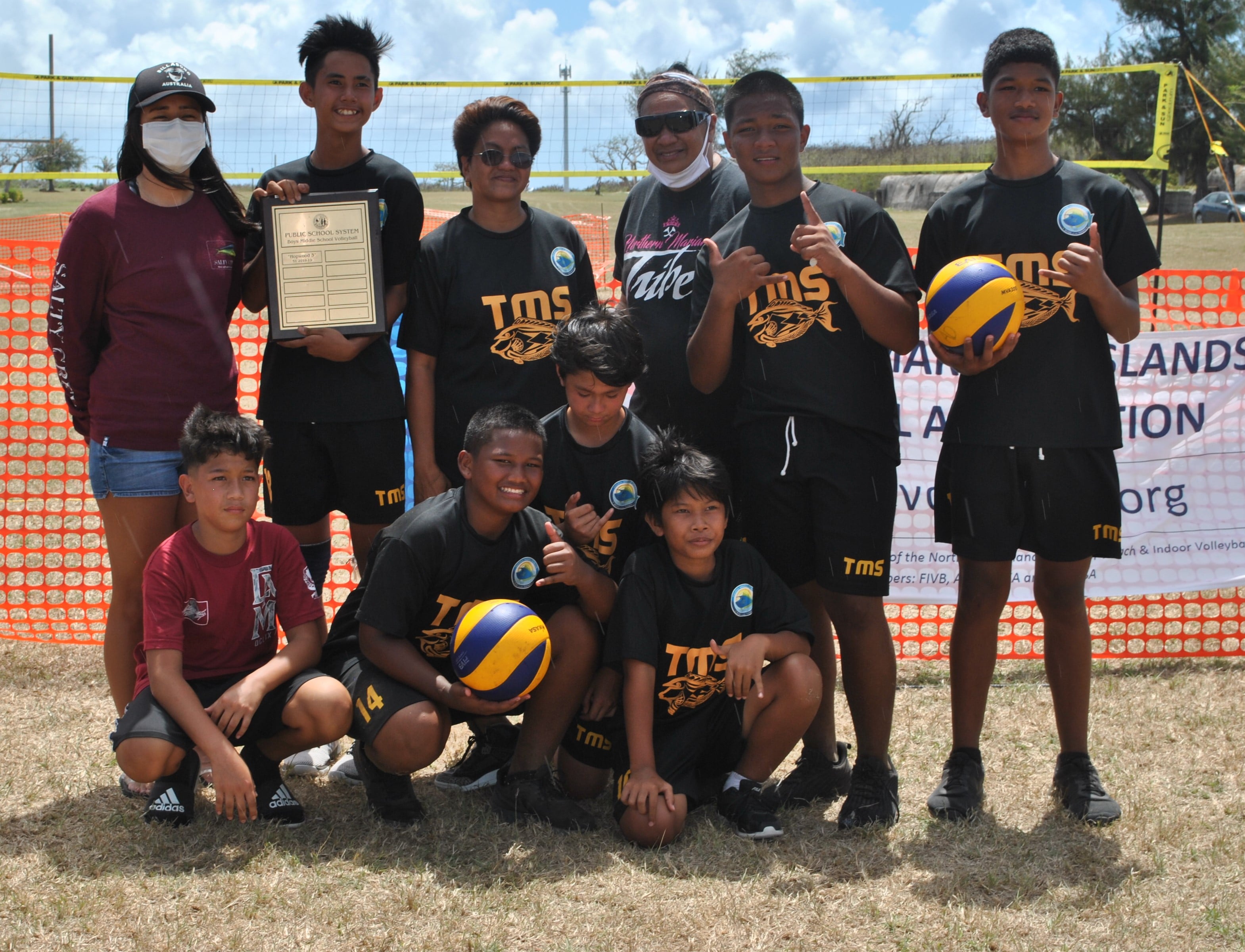 The victorious Tanapag Middle School Tatagas pose with the championship plaque of the PSS Boys 4v4 Grass Volleyball League on Saturday at the CPA Airport Field.Photo James F. Sablan Jr.