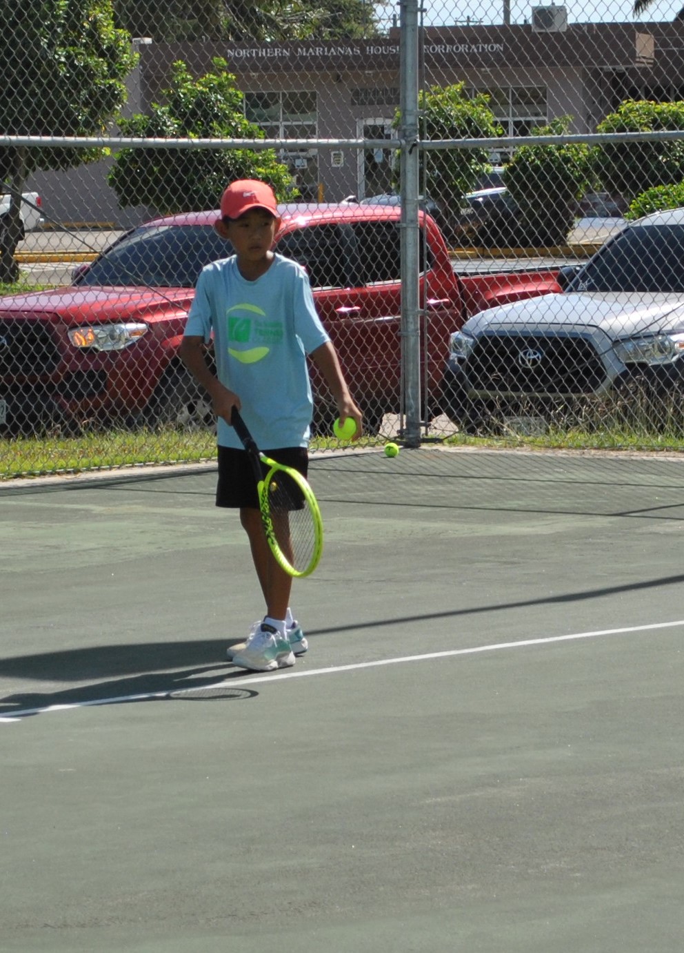 Yutaka Kadokura gets ready for a serve during a 2021 TSL CNMI Junior Tennis Tournament match at an American Memorial Park tennis court.Photo by James F. Sablan Jr.