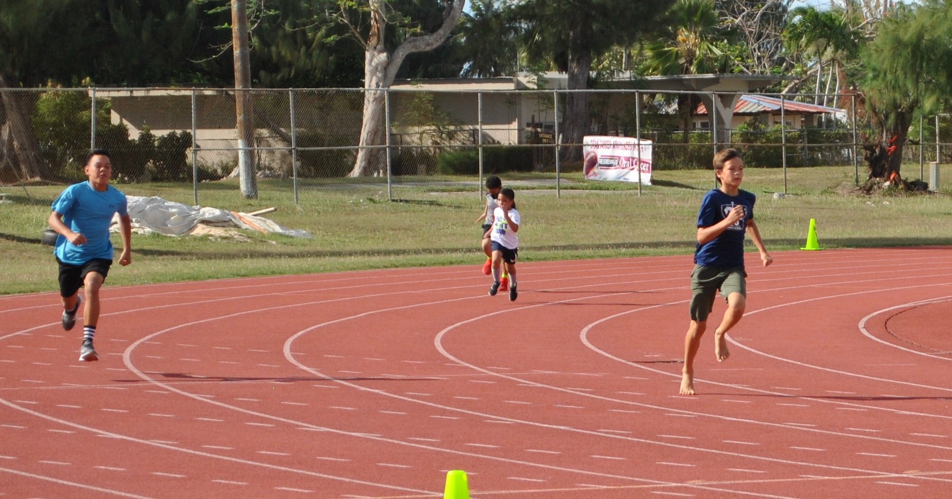 Moshe Sikkel pushes for the finish line during the PSS All School Track & Field Championships on Tuesday at the Oleai Sports Complex.Photo by James F. Sablan Jr.