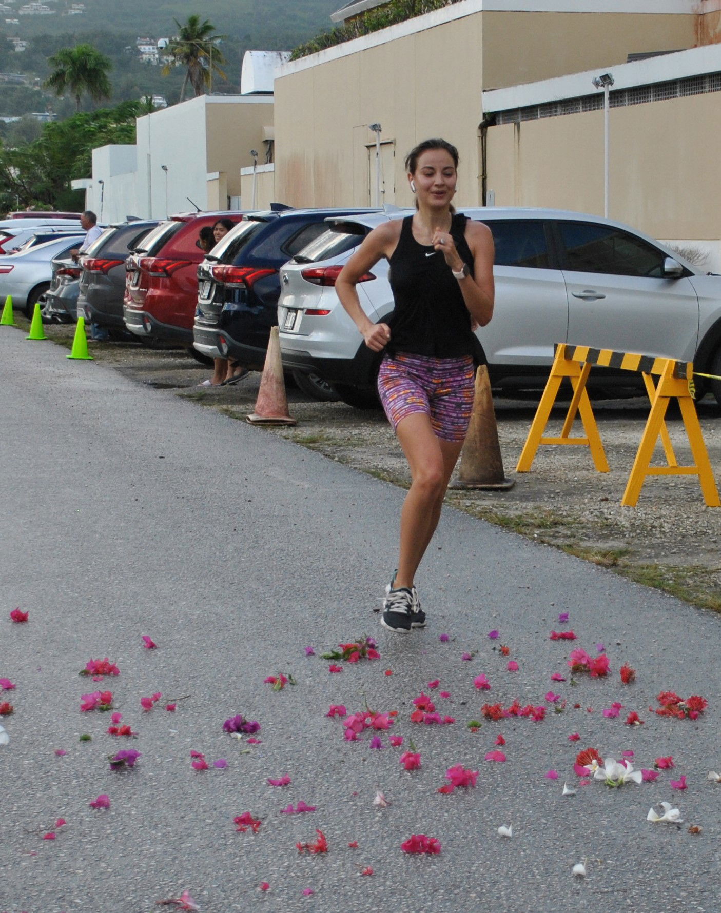Anastasia Inos smiles as she completes the race.
