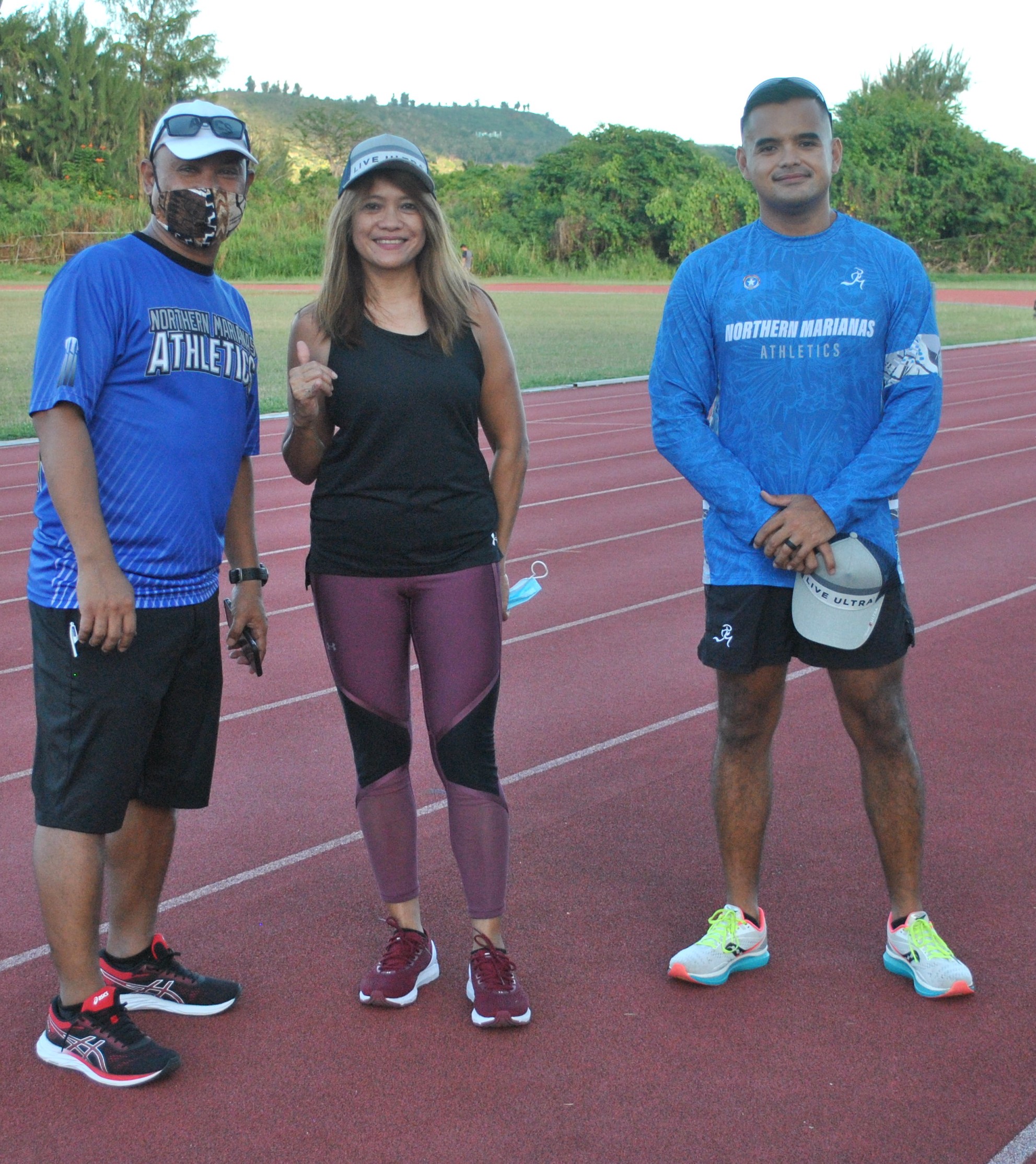 Marie Sablan of the 55-59 age group with Northern Marianas Athletics' Robin Sapong and Edward Dela Cruz Jr. during Thursday's awards ceremony at the Oleai Sports Complex.Photo James F. Sablan Jr.