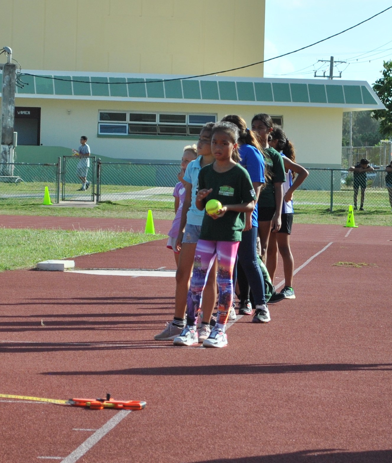 The girls of the U9 softball throw event line up.