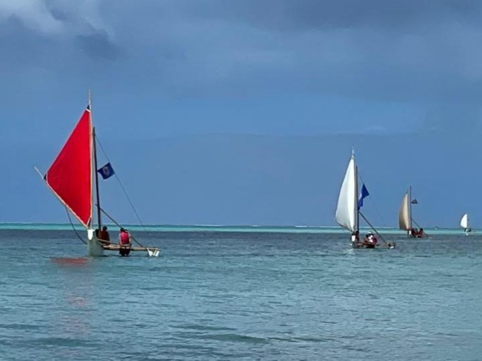 Four 500 Sails canoes eagerly awaiting their new yellow-sailed sister, "Auntie Oba."500 Sails photo