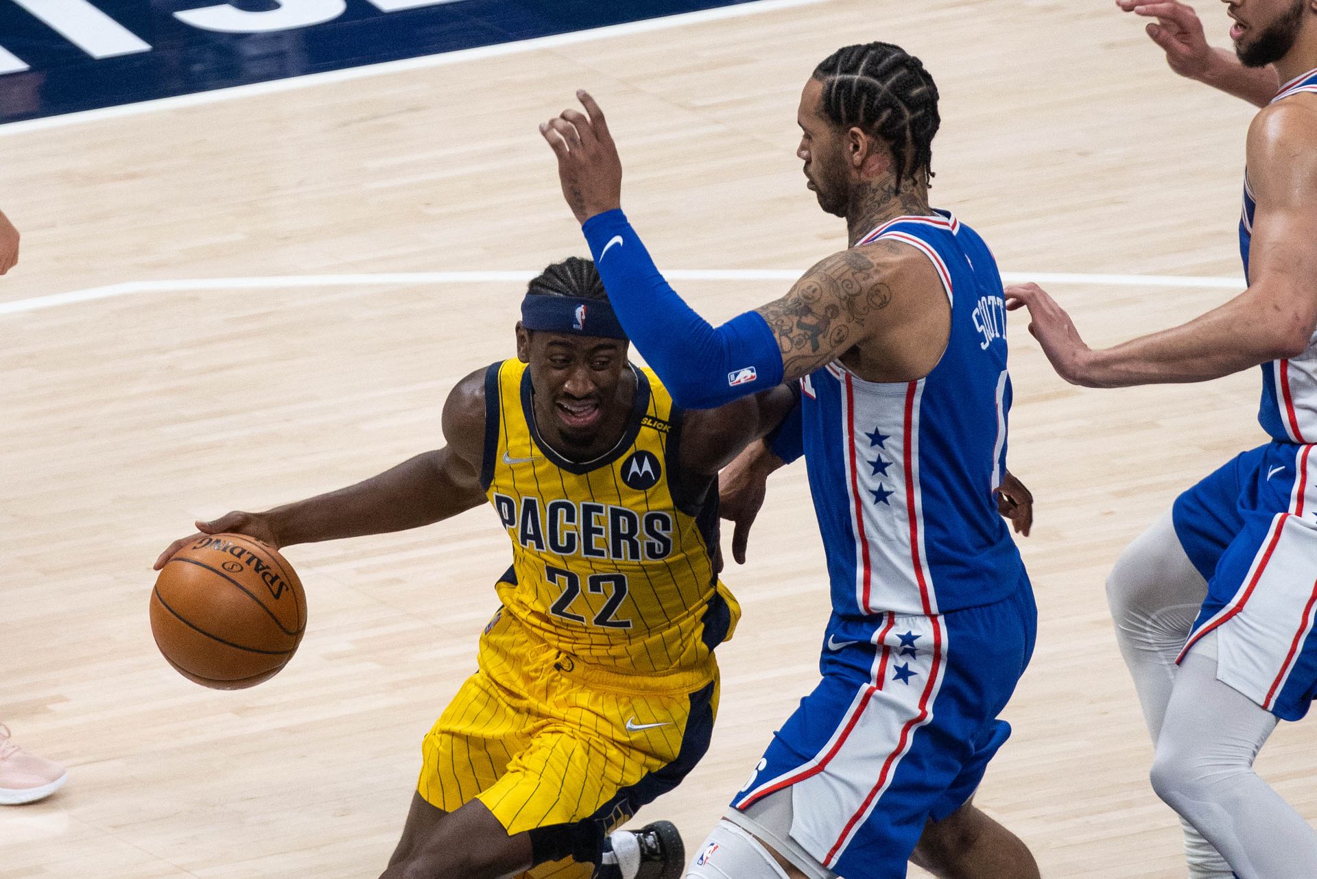 Indiana Pacers guard Caris LeVert (22) dribbles the ball while Philadelphia 76ers forward Mike Scott (1) defends in the second quarter at Bankers Life Fieldhouse Indianapolis, Indiana on May 11, 2021.Photo by Trevor Ruszkowski-USA TODAY Sports