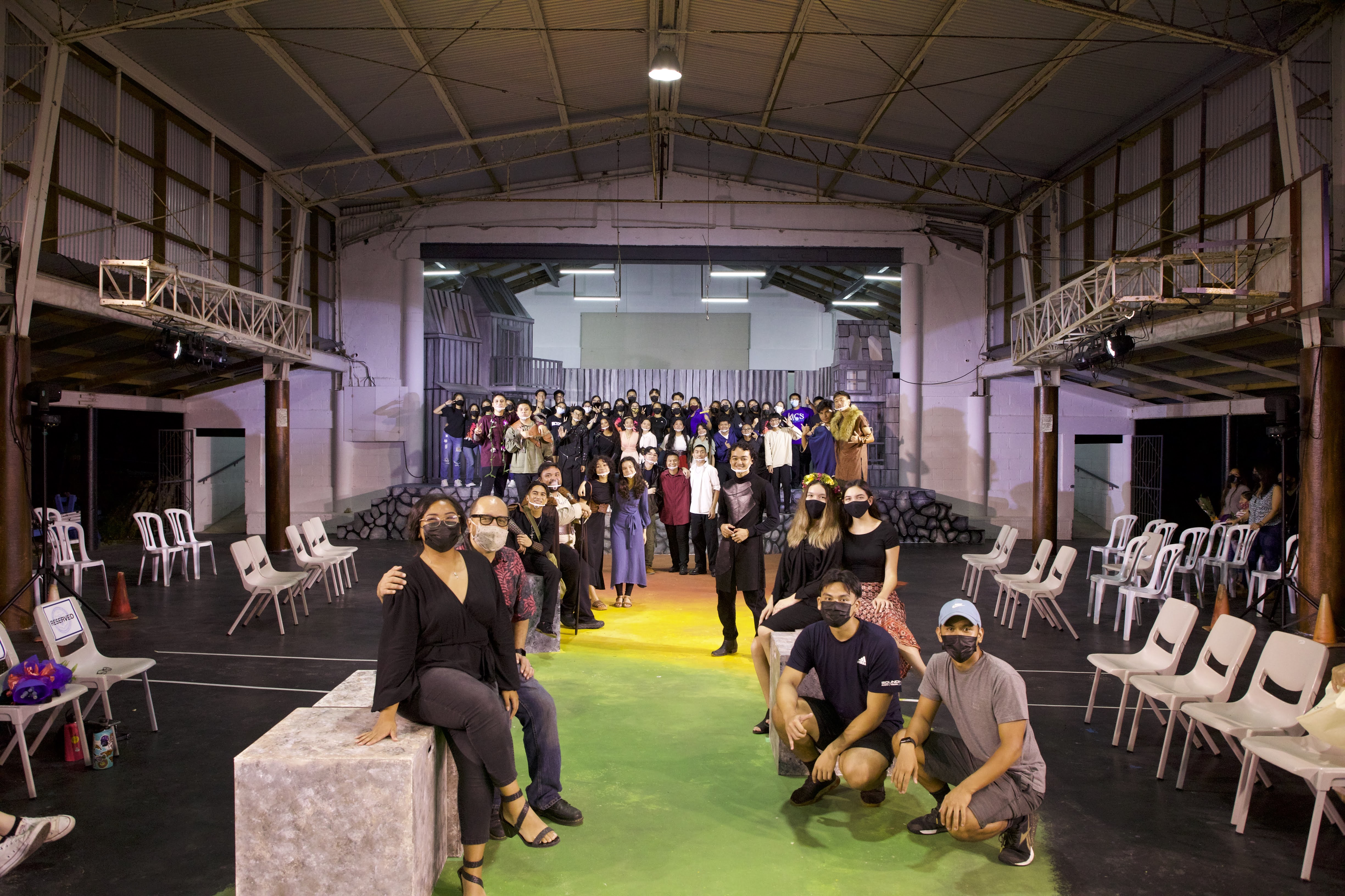 The entire cast and crew that took part in the production pose for a photo.