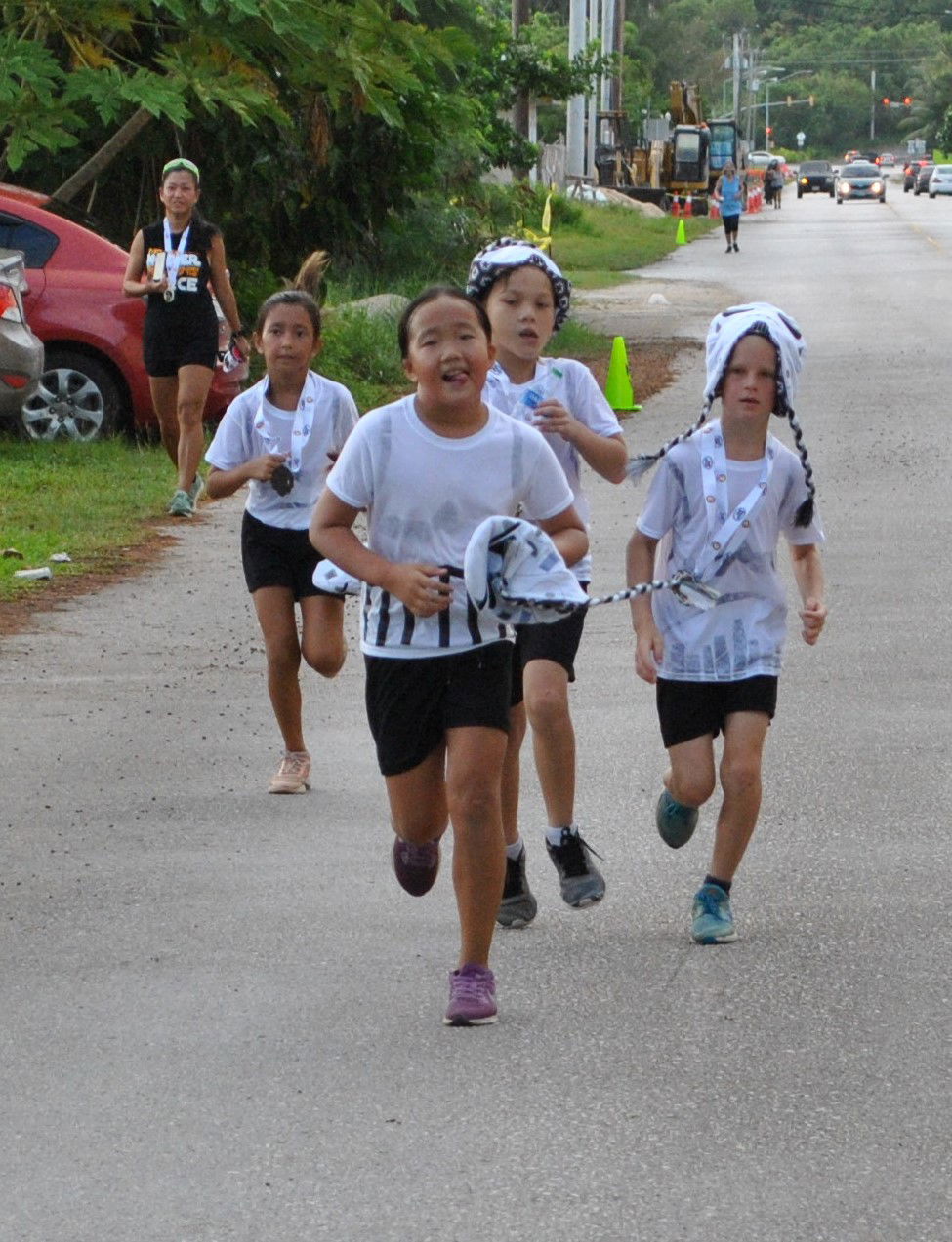 Young Storm Troopers make their way to the finish line.