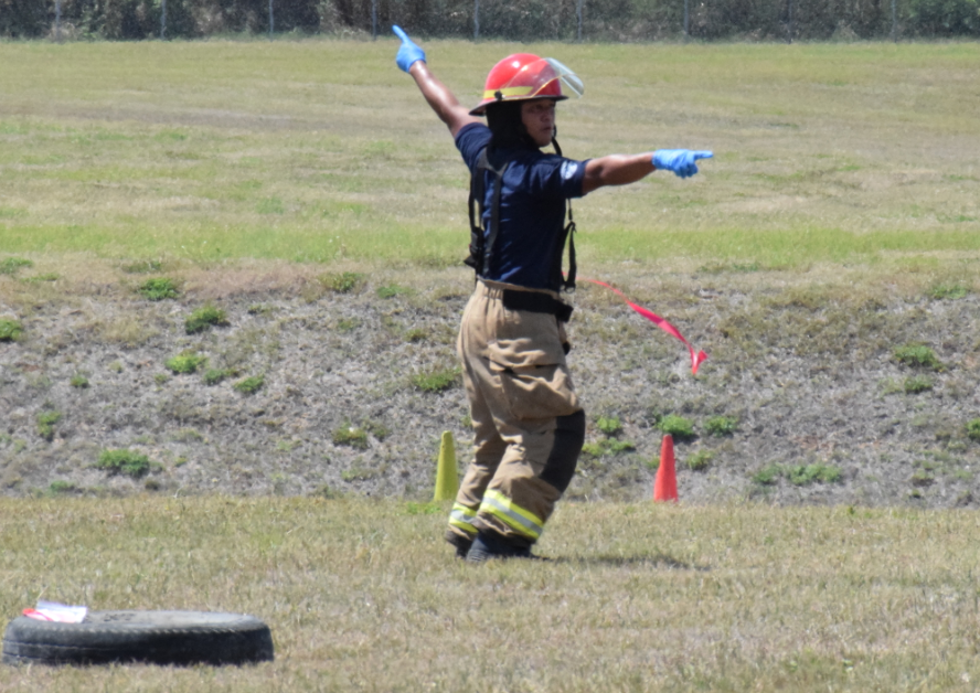 An Aircraft Rescue and Firefighting personnel guides other first responders to the scene.Photo by Emmanuel T. Erediano