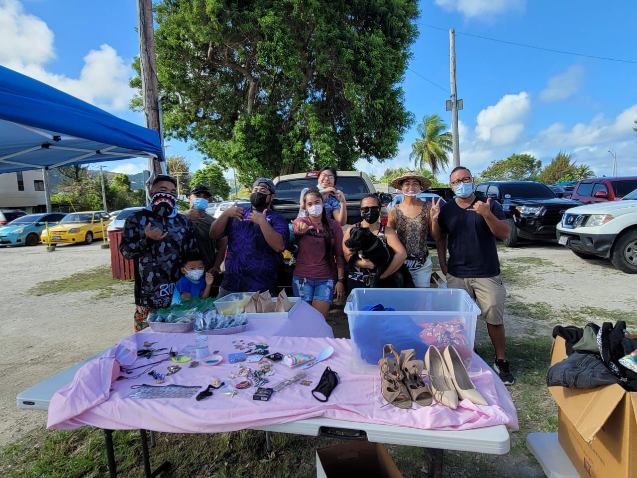 Members of the Kagman High School Class of 2006 pose for a photo at their garage sale on Saturday.Contributed photo
